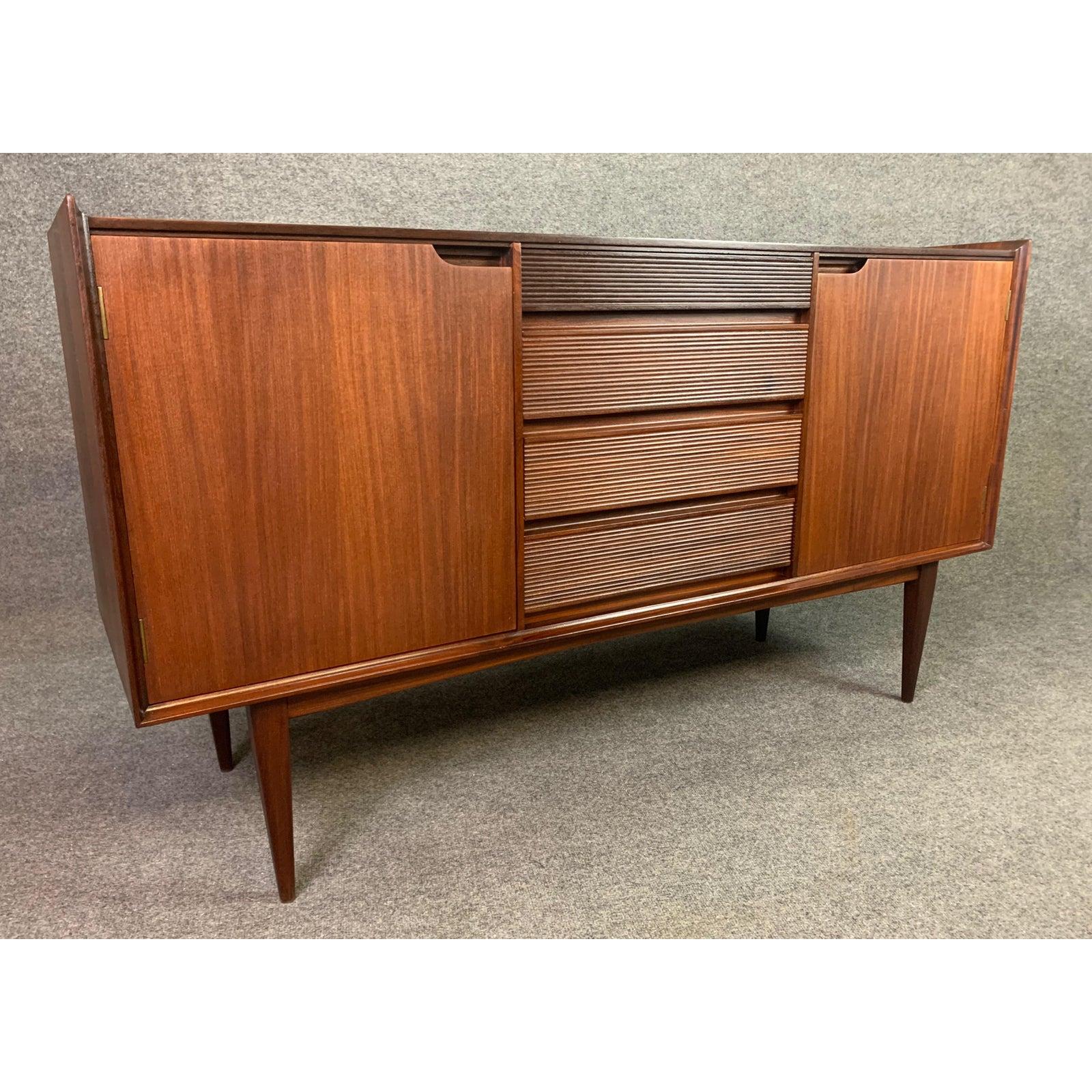 Here is a beautiful Mid-Century Modern sideboard designed by Richard Hornby, manufactured by Fyne Ladye Furniture in England in the 1960s and sold at Heals of London.
This special piece, recently imported from UK to California before its