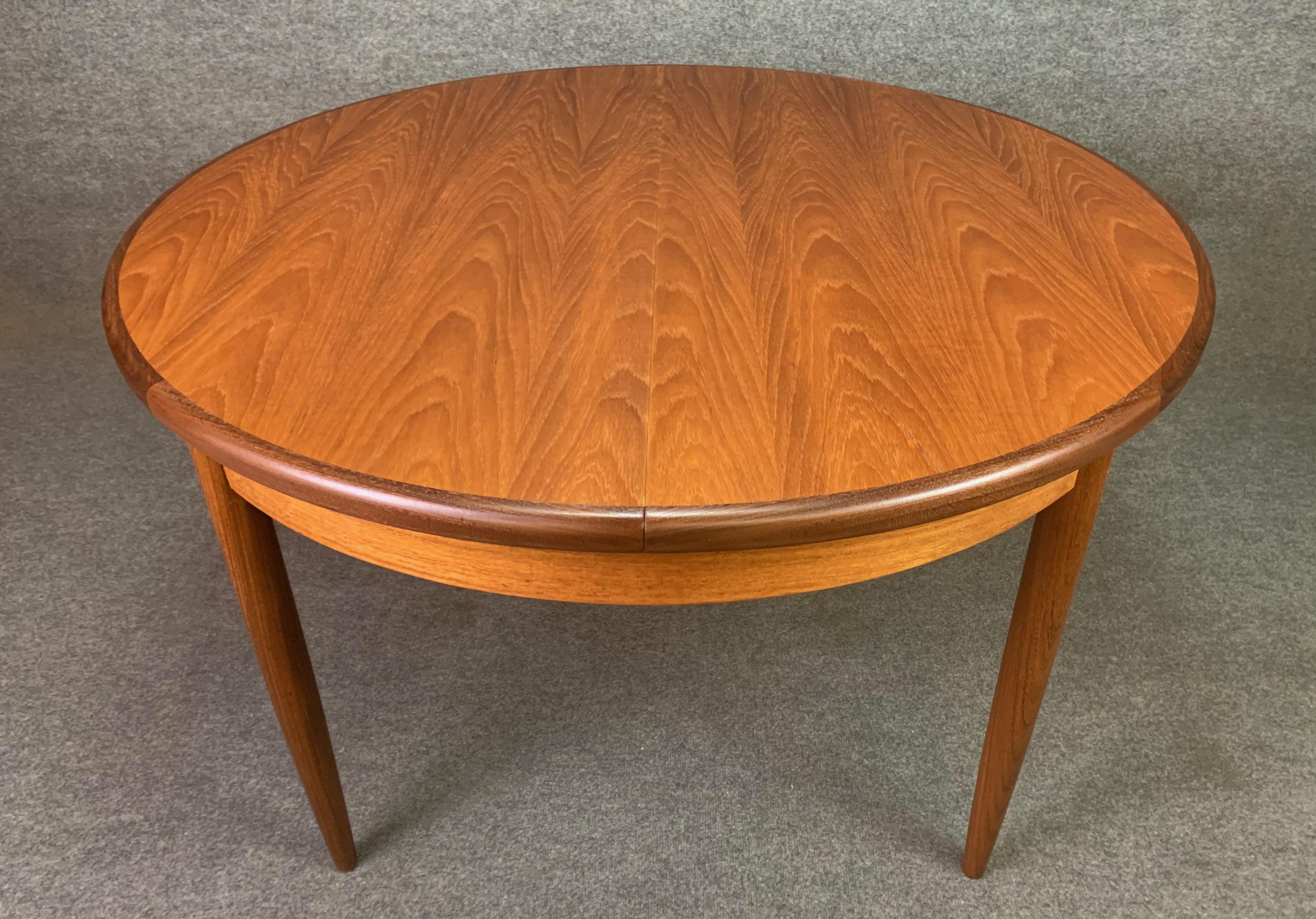 Here is a beautiful British midcentury dining table in teak designed by Victor Wilkins and manufactured by G Plan in England in the 1960s.
This exquisite table, recently imported from UK to California before its restoration, features a vibrant wood