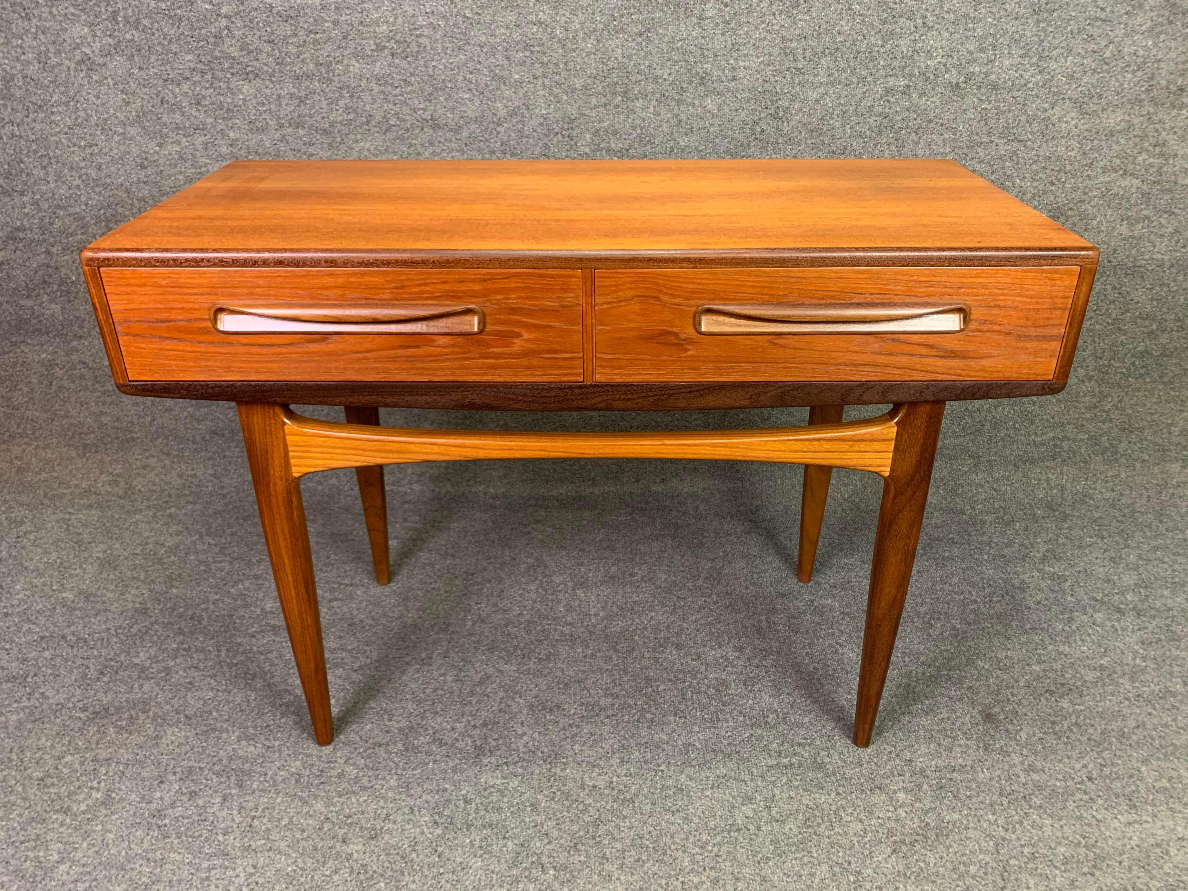 Here is a rare british Mid-Century Modern teak entry table - console part of the sought after 