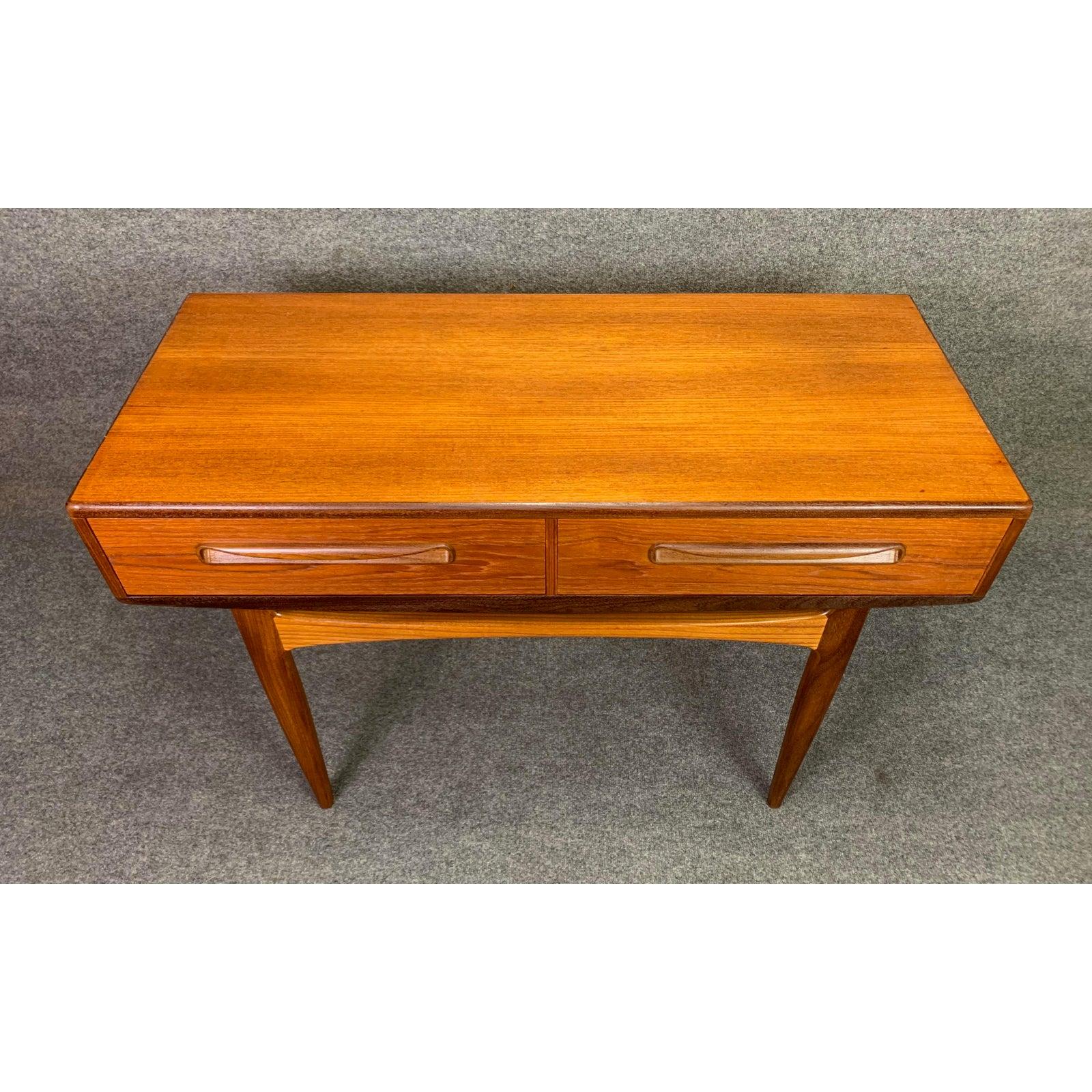 Here is a rare British Mid-Century Modern teak entry table, console part of the sought after 