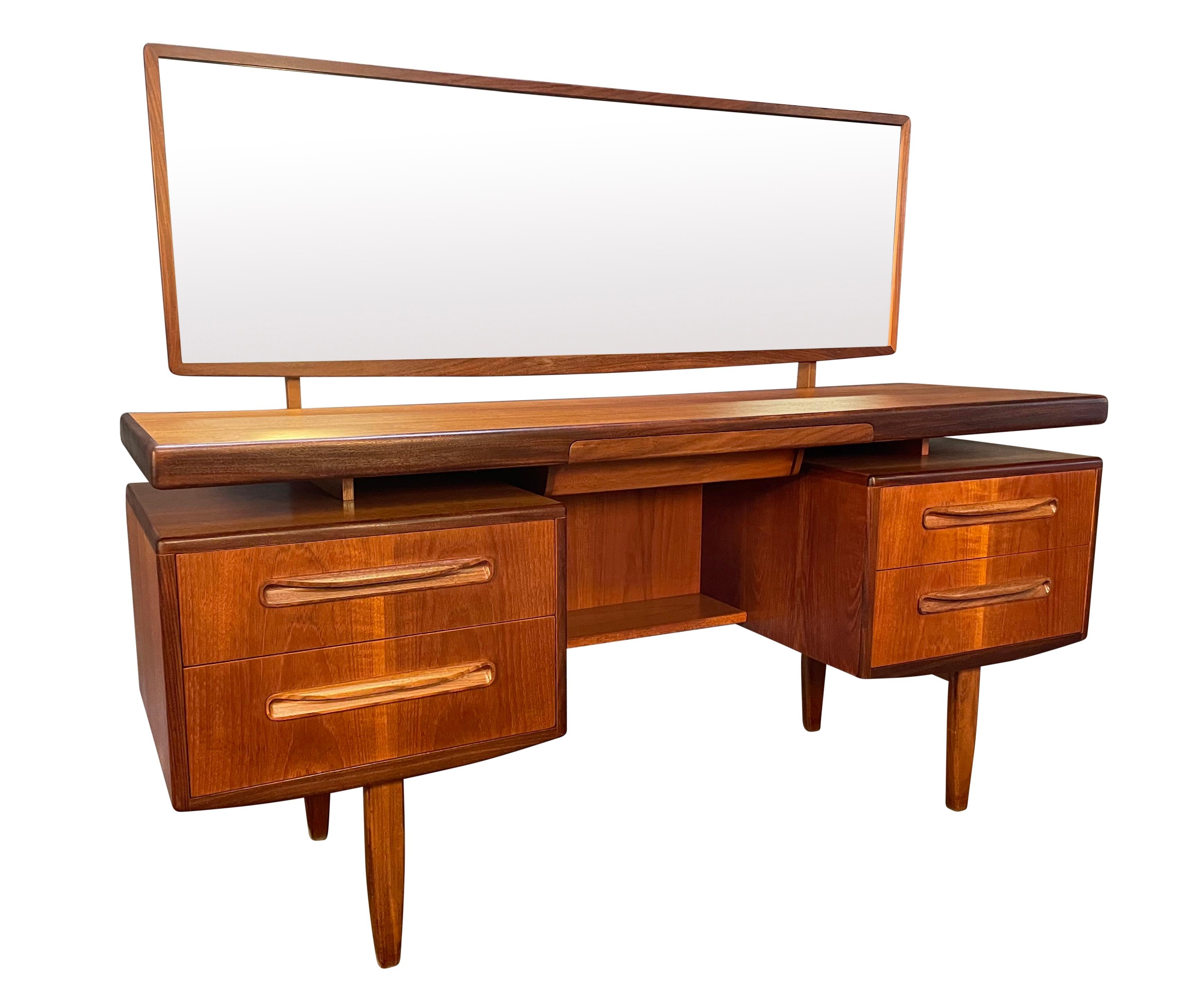 Here is a beautiful British mid century modern vanity in teak wood from the 