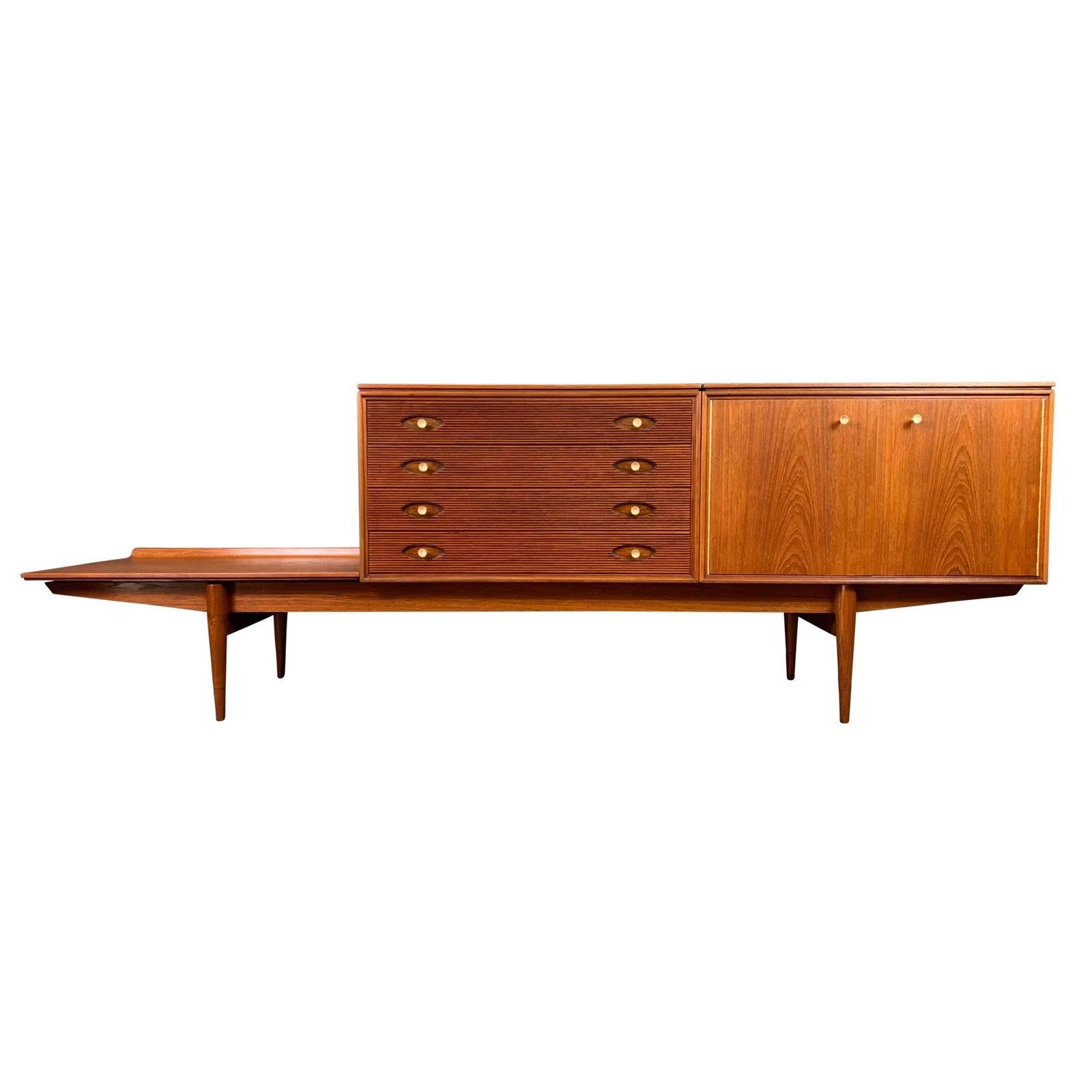 Here is a very rare british MCM modular sideboard designed by Richard Heritage and manufactured by Archie Shine in UK in the 1960s.
This very special piece, recently imported from England to California before its restoration, is composed of three