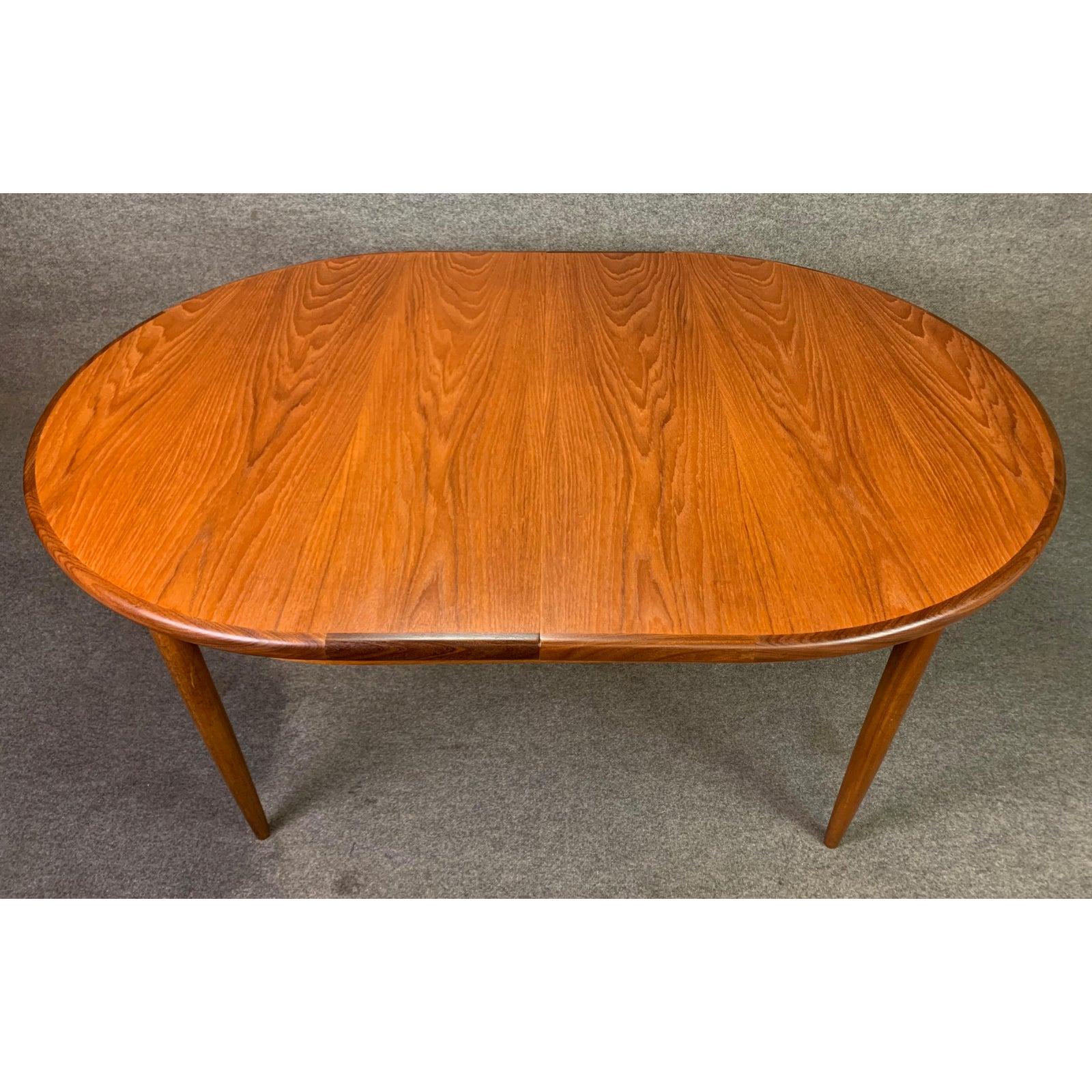 Here is a beautiful 1960s large dining table in teak wood designed by Victor Wilkins for the sought after 