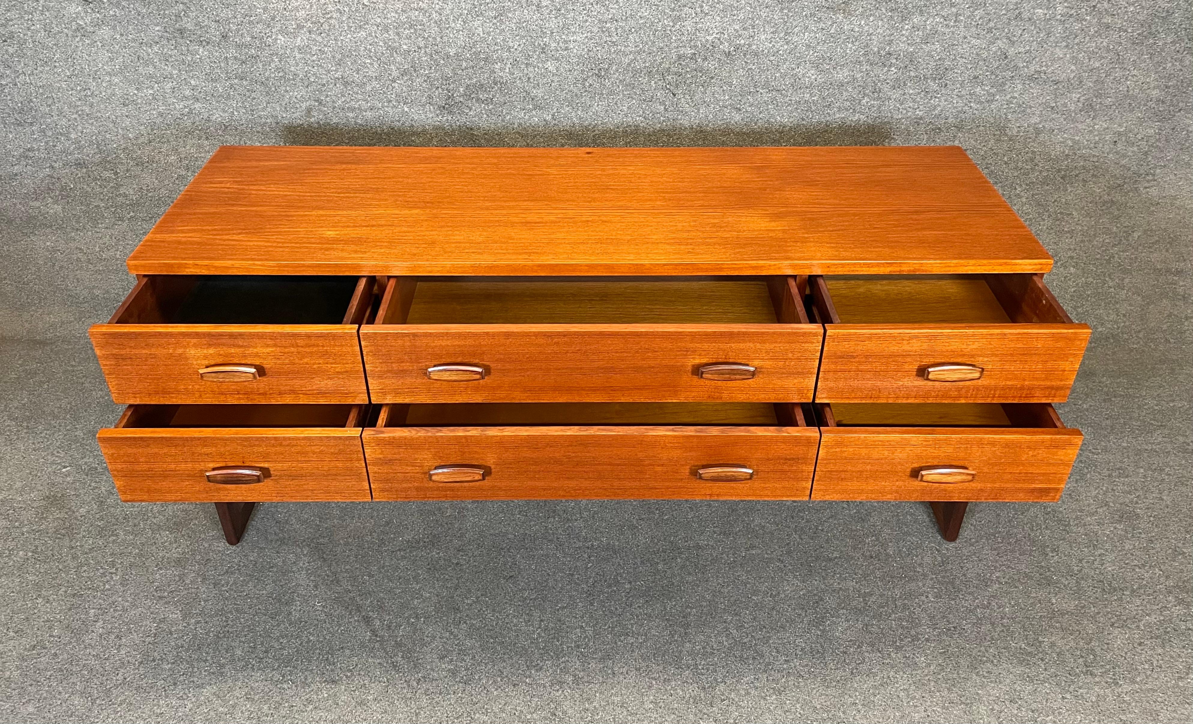 Here is a beautiful and rare British MCM teak credenza-dresser-console from the 