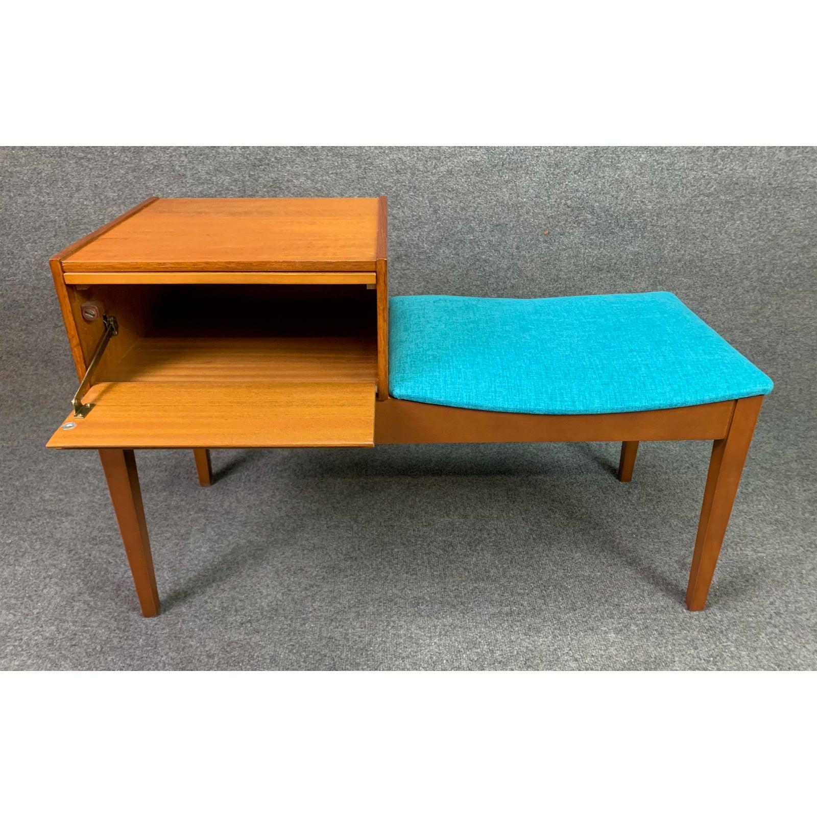 Here is a special British MCM telephone bench manufactured by Chippy in England in the 1960s.
This rare piece, recently imported from UK to California before its restoration, features a teak storage cubby with a drop down door and a slide out tray,