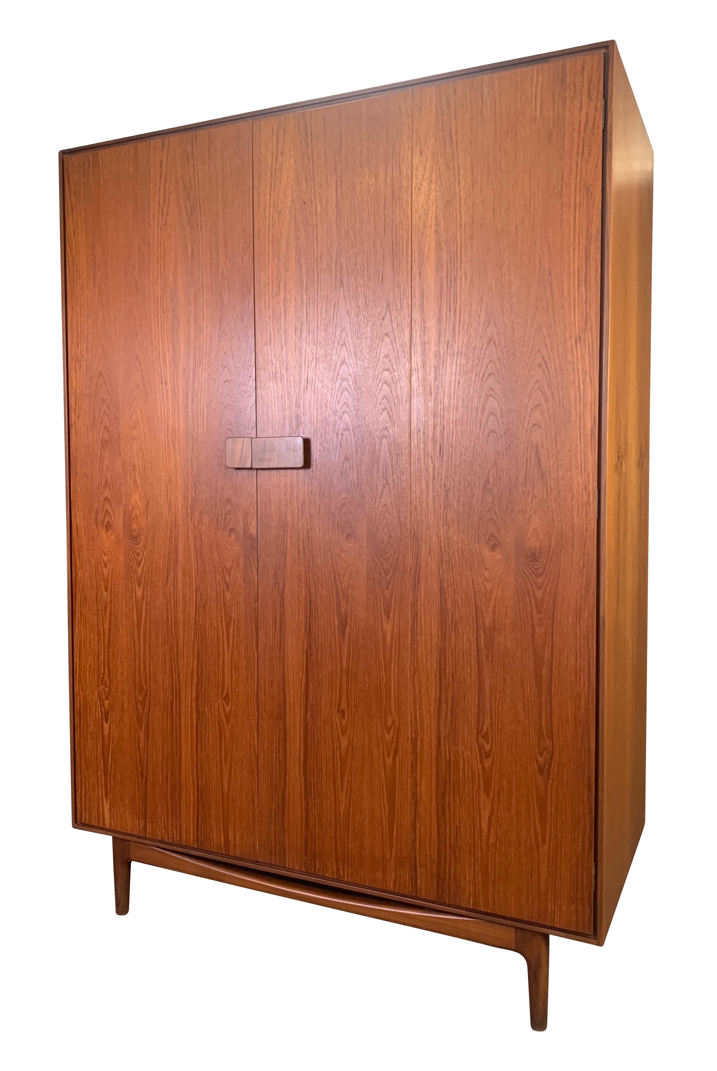 Here is a rare and large armoire in teak wood designed by master Scandinavian designer Ib Kofod Larsen for G Plan manufactured in England in the 1960s.
This British wardrobe, recently imported from UK to California, features a vibrant wood grain,
