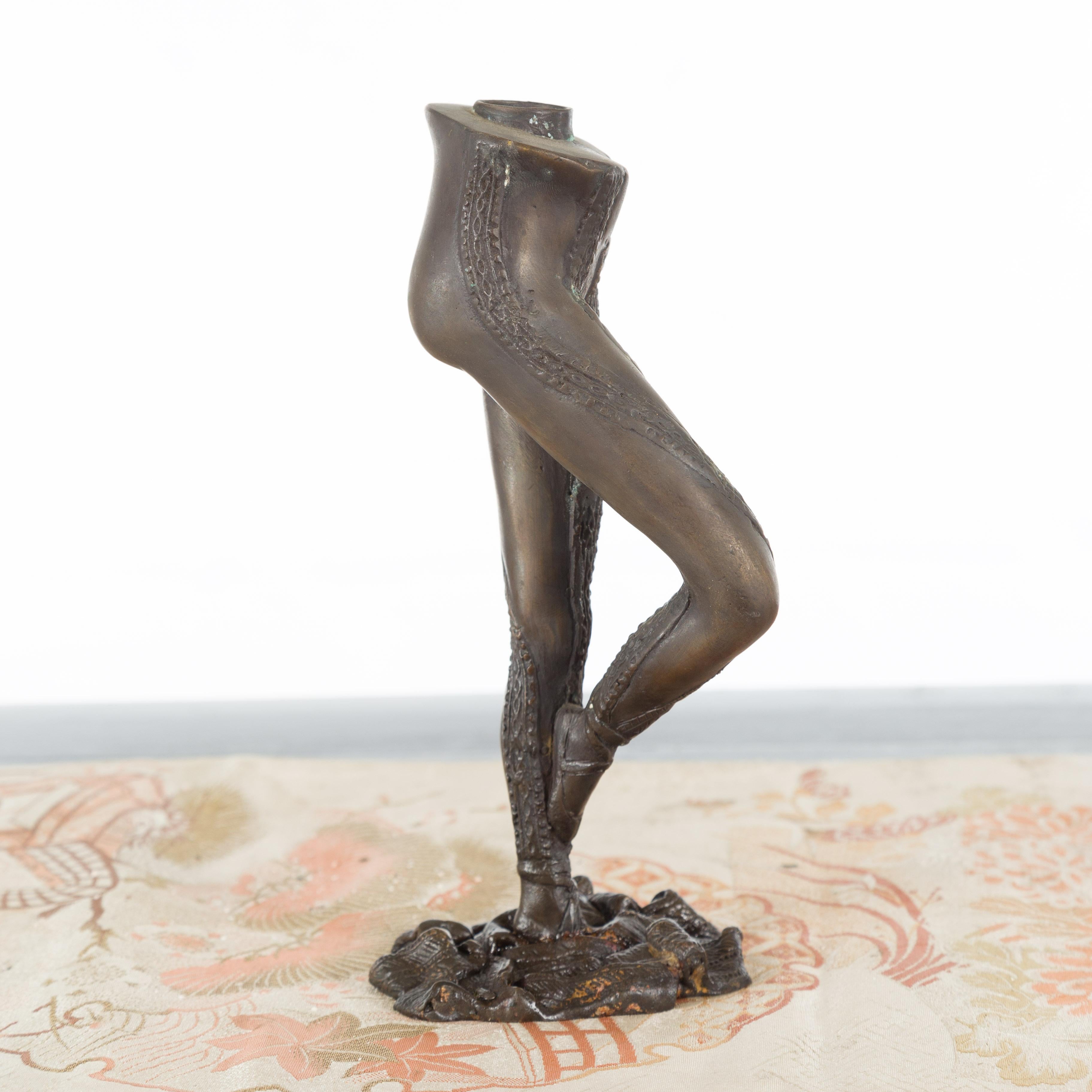 A cast bronze ballerina leg candle holder from the mid 20th century, in Frappé position. We currently have several available, priced and sold individually $250 each. Created with the traditional technique of the lost-wax (à la cire perdue) which