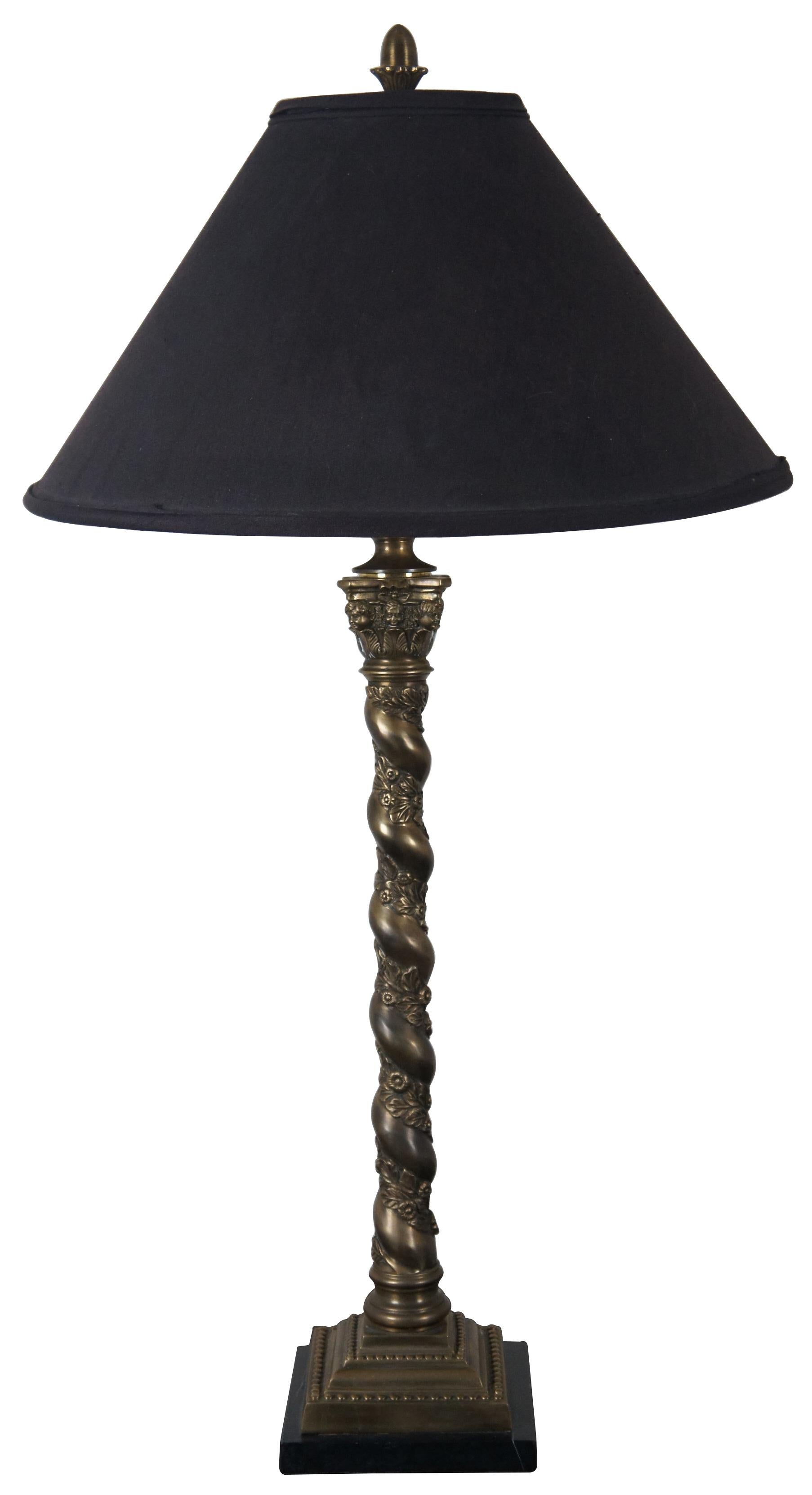 Vintage bronze barley twist lamp pair attributed to Theodore Alexander. Features Corinthian columns with cherubs or pooties on marble base with acorn finials and floral motif. Very heavy.

Measures: Shade - 20” x 10” / Height to top of finial –