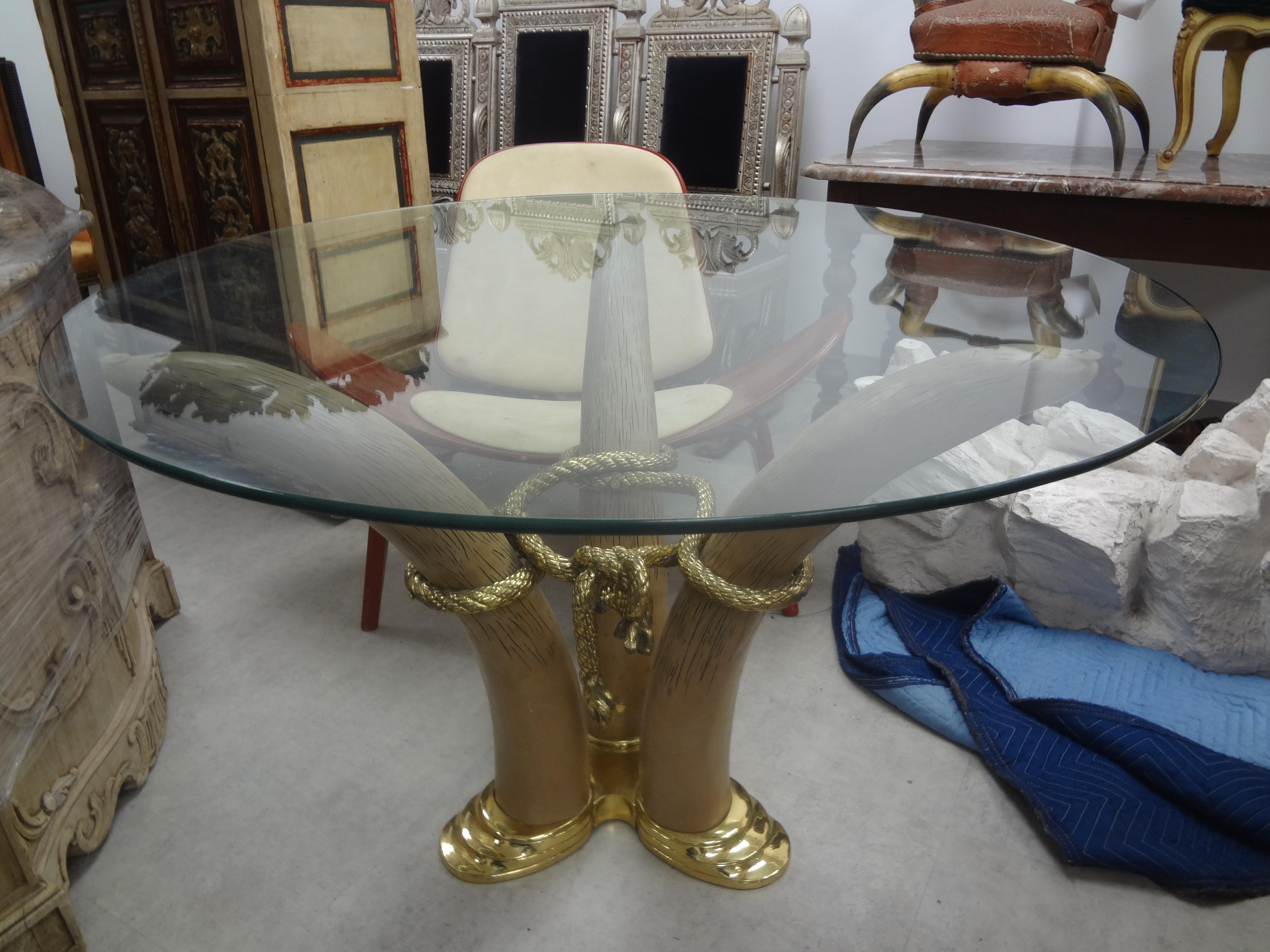 Vintage bronze faux elephant tusk center table by Italo Valenti.
Vintage bronze and resin faux elephant tusk center table by Italo Valenti of Barcelona, Spain. This gorgeous heavy weight postmodern center table currently has a 42 inch glass top but