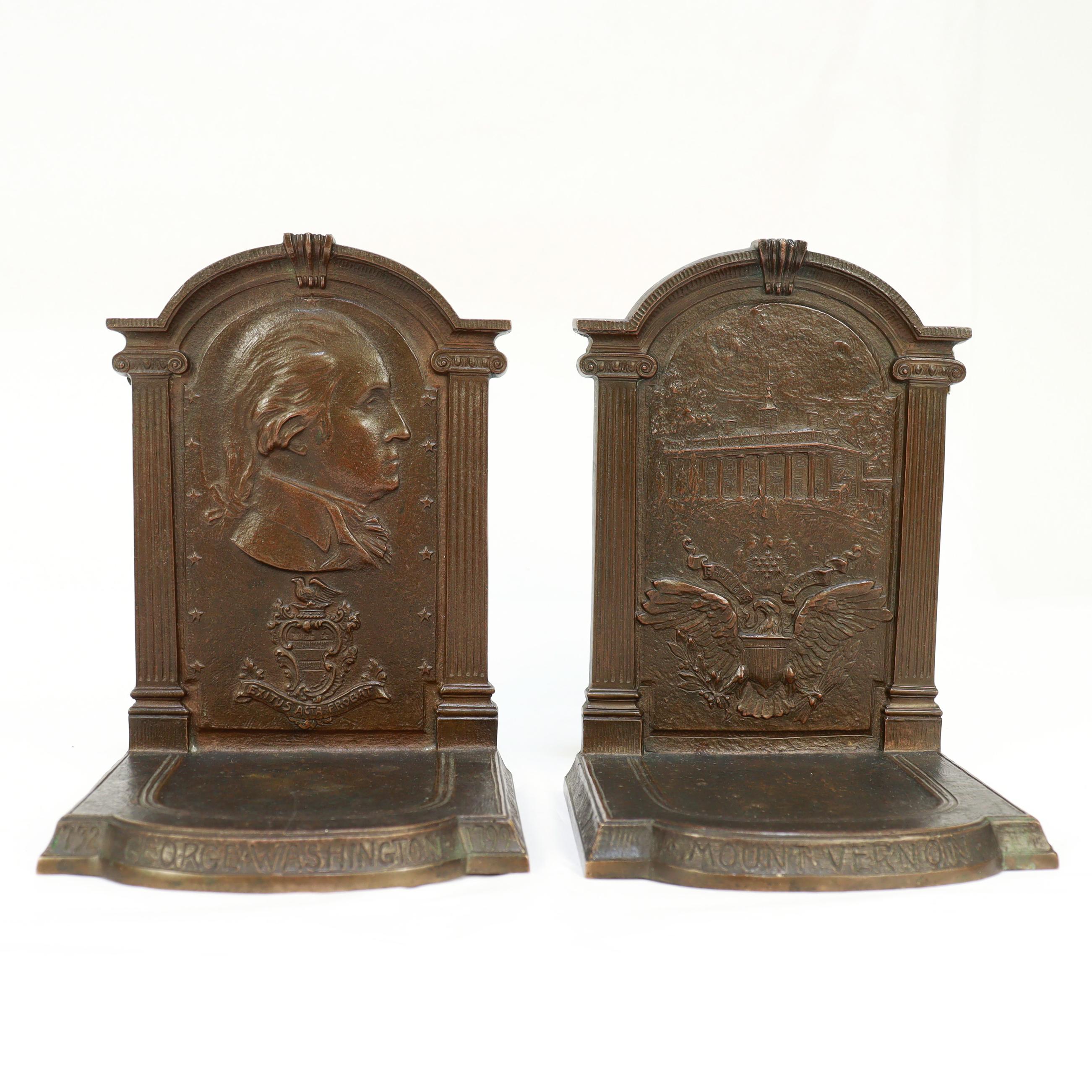 A fine pair of bronze bookends.

By F.R. Woodward.

In bronze.

One bookend with George Washington in profile with the Washington family coat of arms and family motto 'Exitus acta probat' (