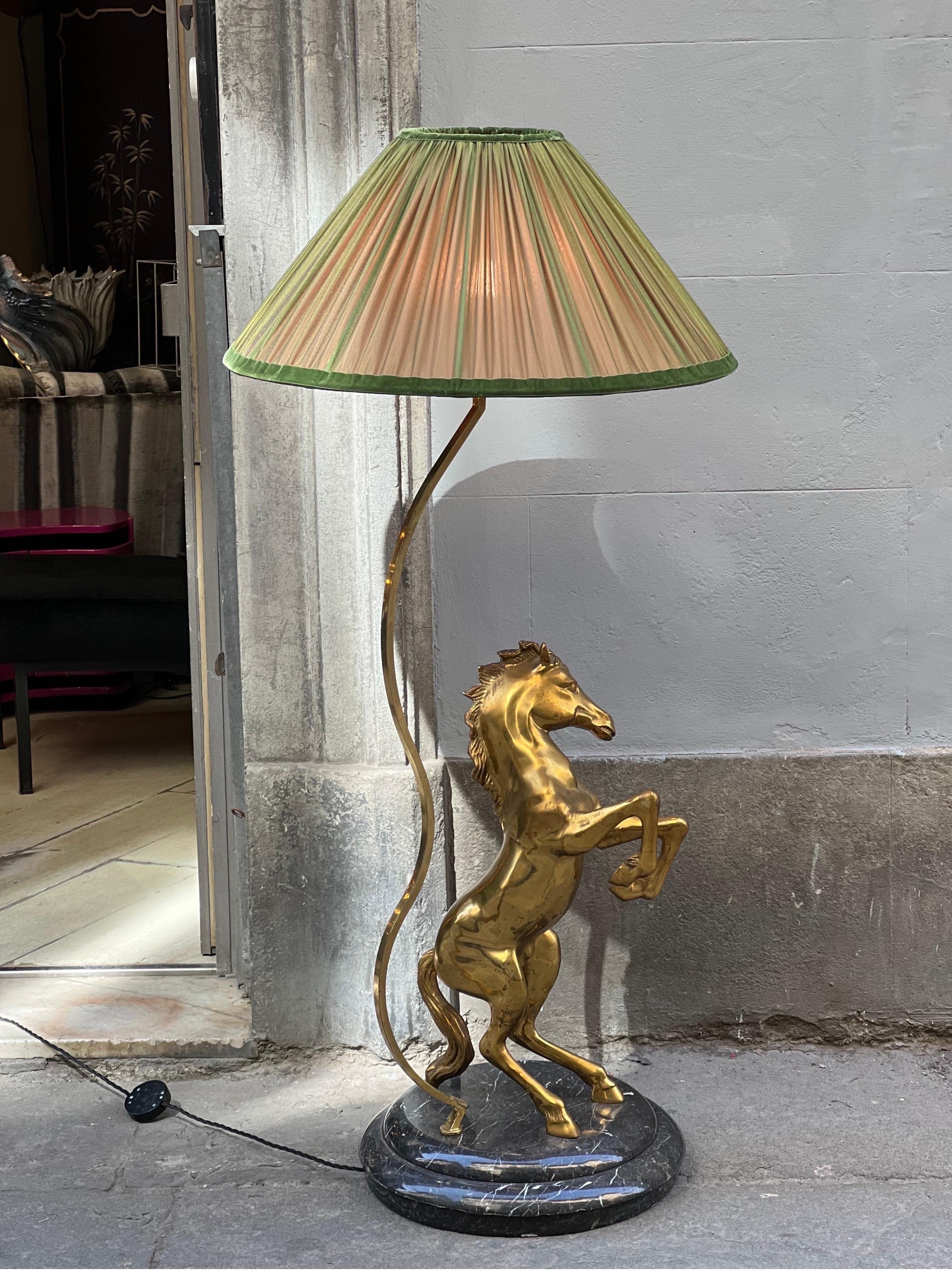 Vintage Italian bronze horse floor lamp with round marble base and our handcrafted lampshade.
The double-color lampshade is handmade in our internal laboratory using ruffled double-color silk chiffon bronze on the outside and green on the inside.