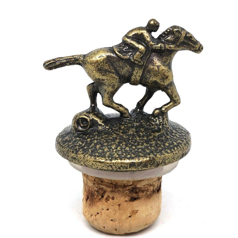 A beautiful metal and cork bottle stopper. Some wear with a nice patina, but this is old-age. Made of metal and cork. A beautiful nice barware item or just a display item in your collections of antique bottle stoppers.

   
