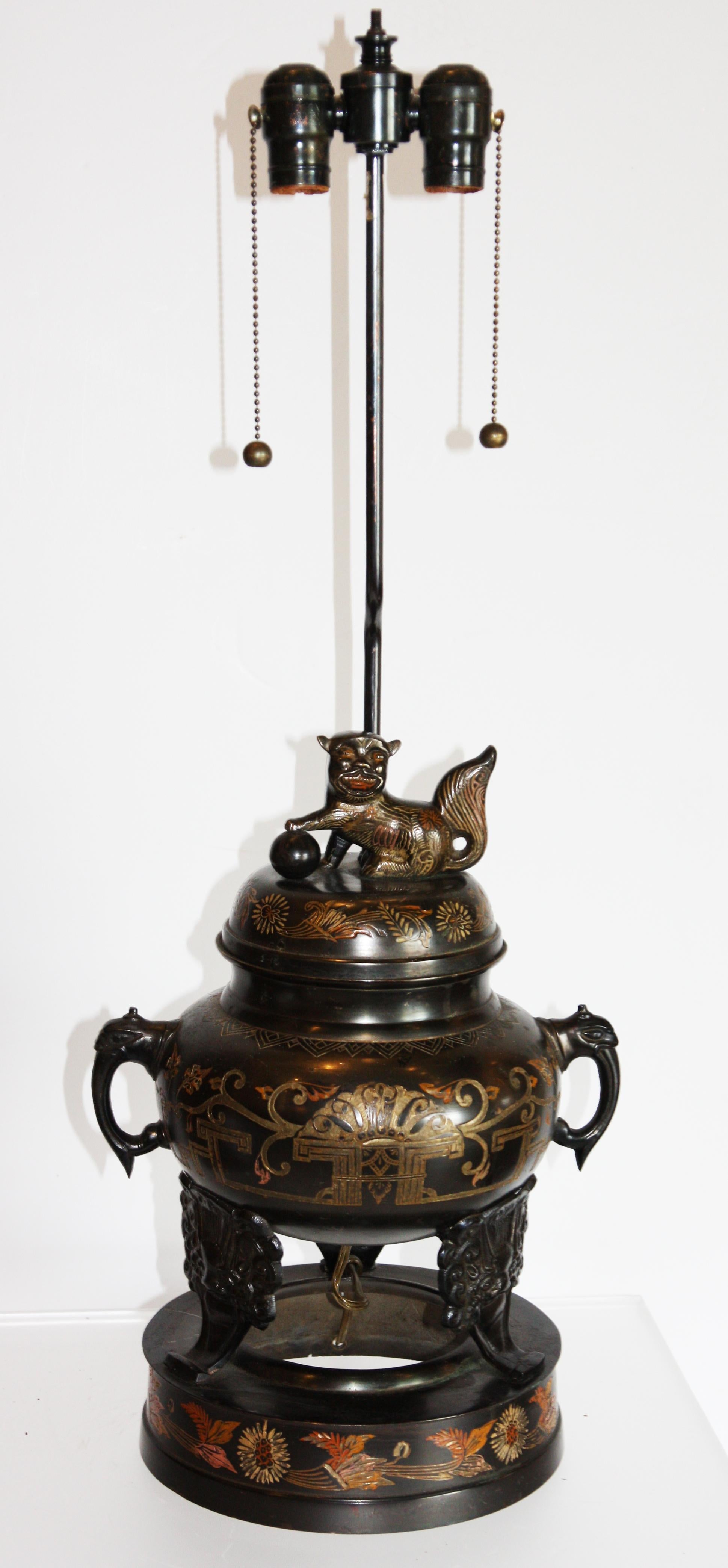 Vintage bronze Marbro lamp made out of engraved urn. A small, engraved, cat sits atop the urn. Original lampshade included. Marbro stamp on neck of lamp.