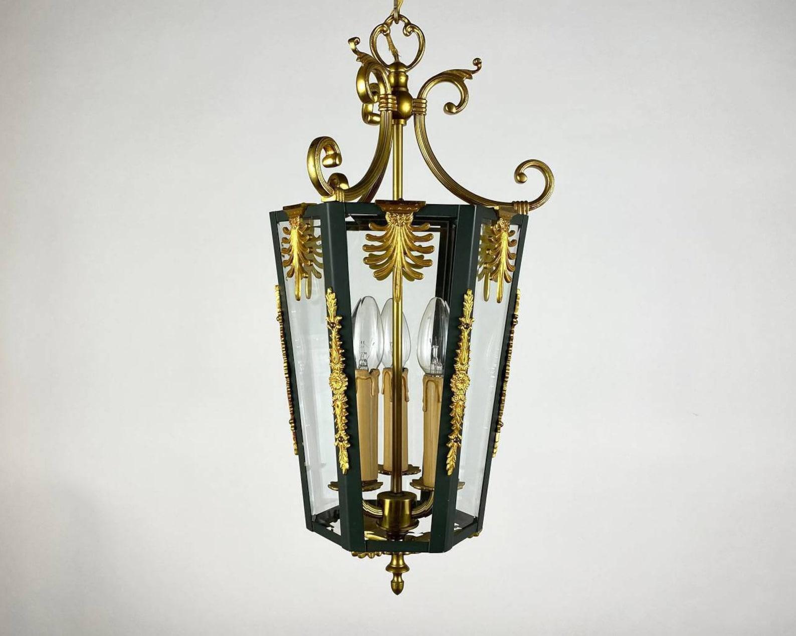 The delightful Vintage ceiling chandelier / lantern is made of bronze and glass hall lantern in hexagonal shape. 

 France, circa 1970s. 

 The frame is made of Dark Green Metal, decorated with three-dimensional patterns, leaves and decorative