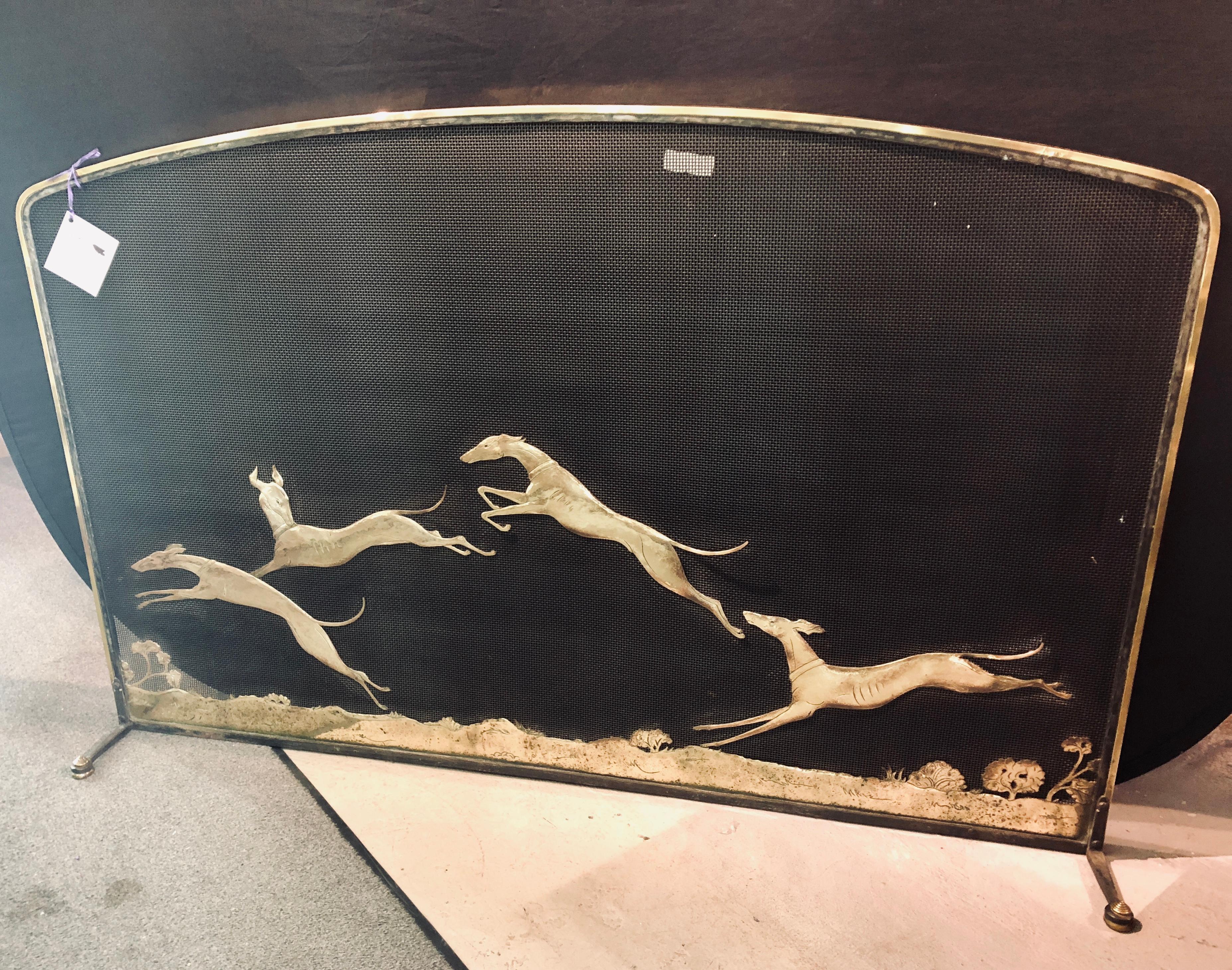 Vintage Bronze Monumental Firescreen signed by Oscar Bach of a group of Running Hounds. This one of a kind firescreen is not only artist signed but is also Pat Pending. The over sized bronze screen depicts four steeplechase hounds jumping over the