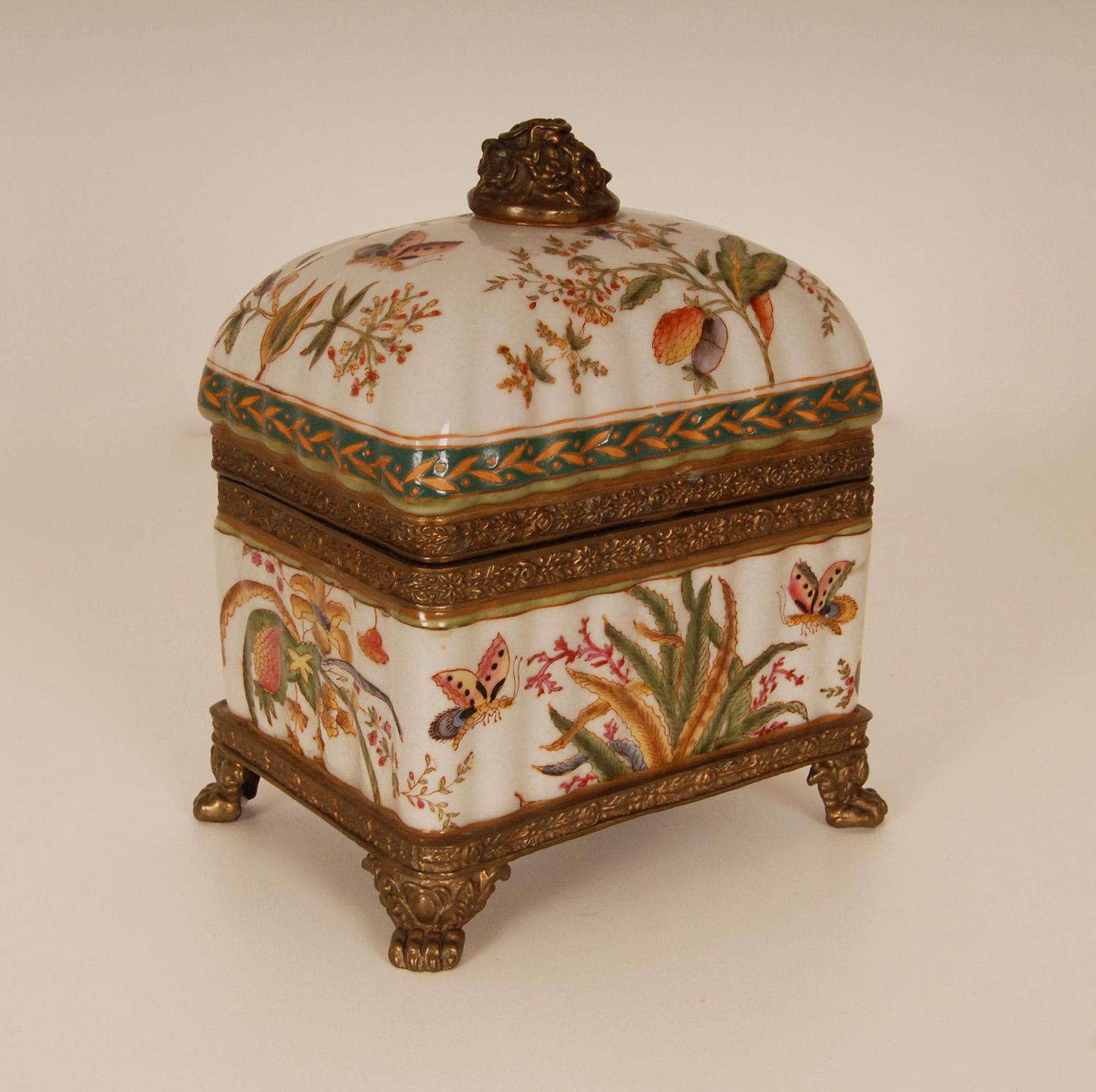 Porcelain bronze mounted box, Art Nouveau style
Made of hand-painted crackled, glazed high quality bronze mounted porcelain. Signed on the bottom. 
An all over polychrome floral decoration with butterflies, with a bronze stand on lion claw feet and
