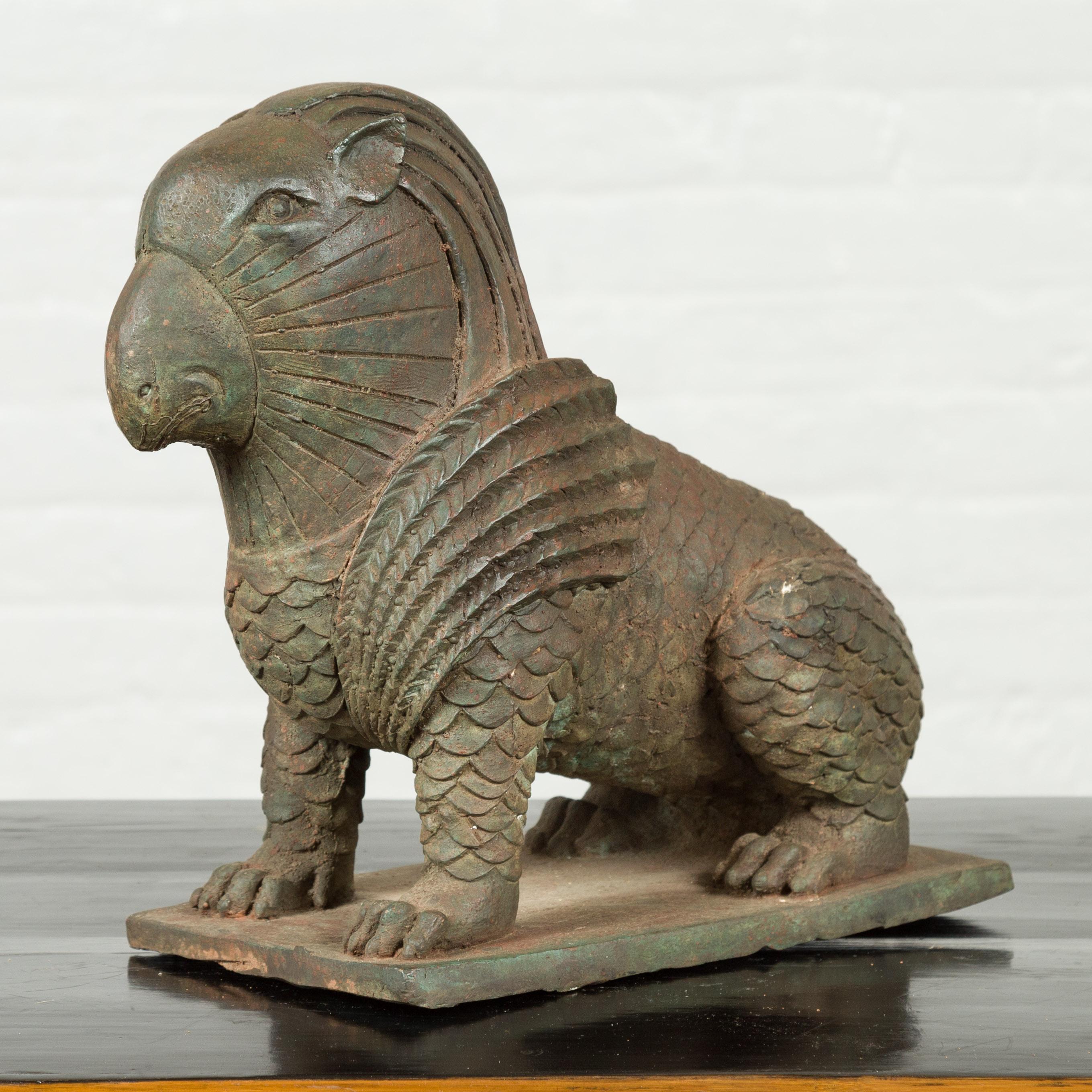 A vintage bronze mythical animal sculpture from the mid-20th century with verde patina. Created with the traditional technique of the lost-wax (à la cire perdue) that allows a great precision and finesse in the details, this animal sculpture