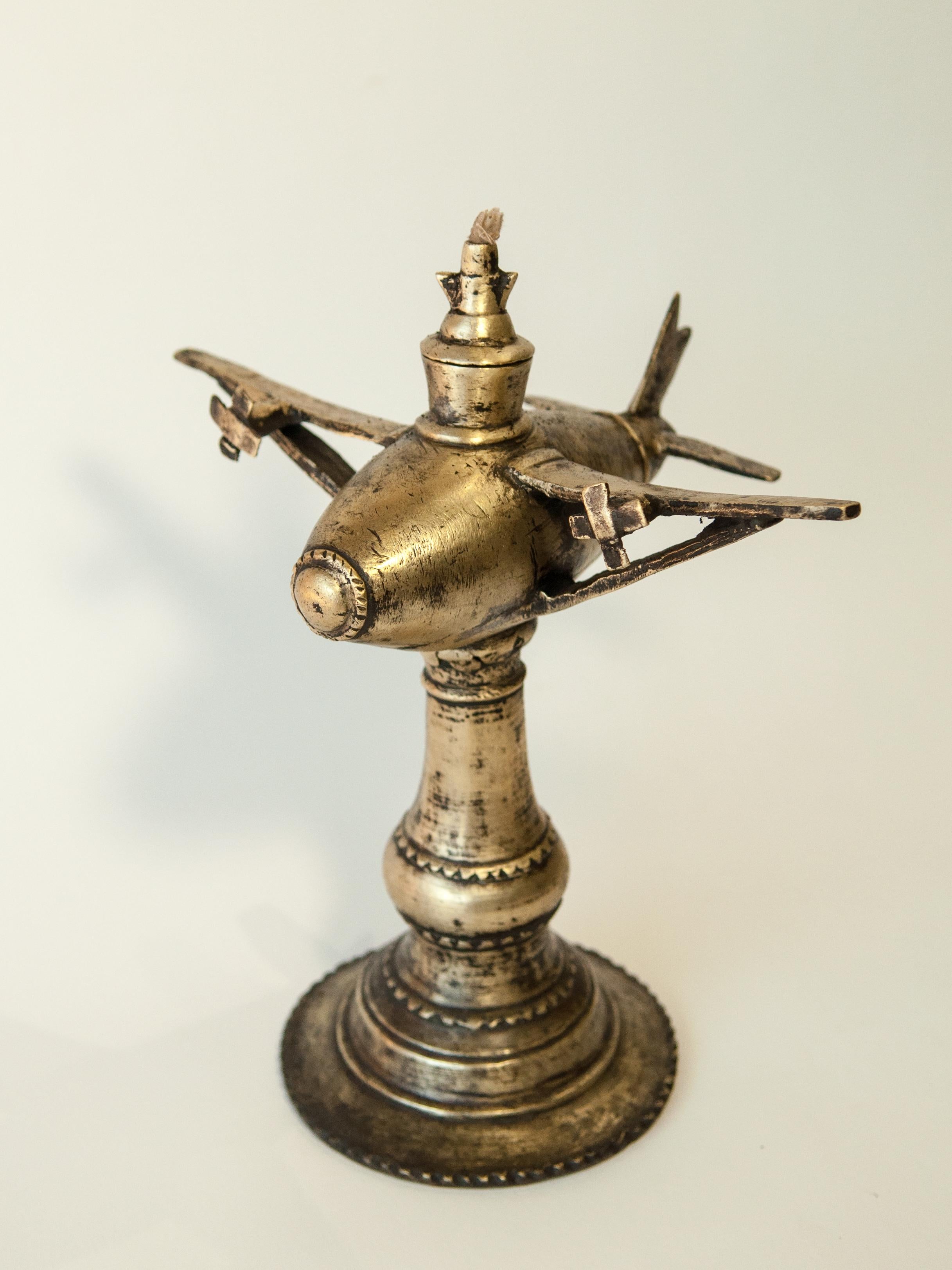 Rare vintage bronze oil lamp. Airplane motif. Rural Nepal. Mid-late 20th century offered by Bruce Hughes.
Bronze oil and kerosene lamps were widely used throughout the mountain and hill areas of Nepal, but as availability of electricity through