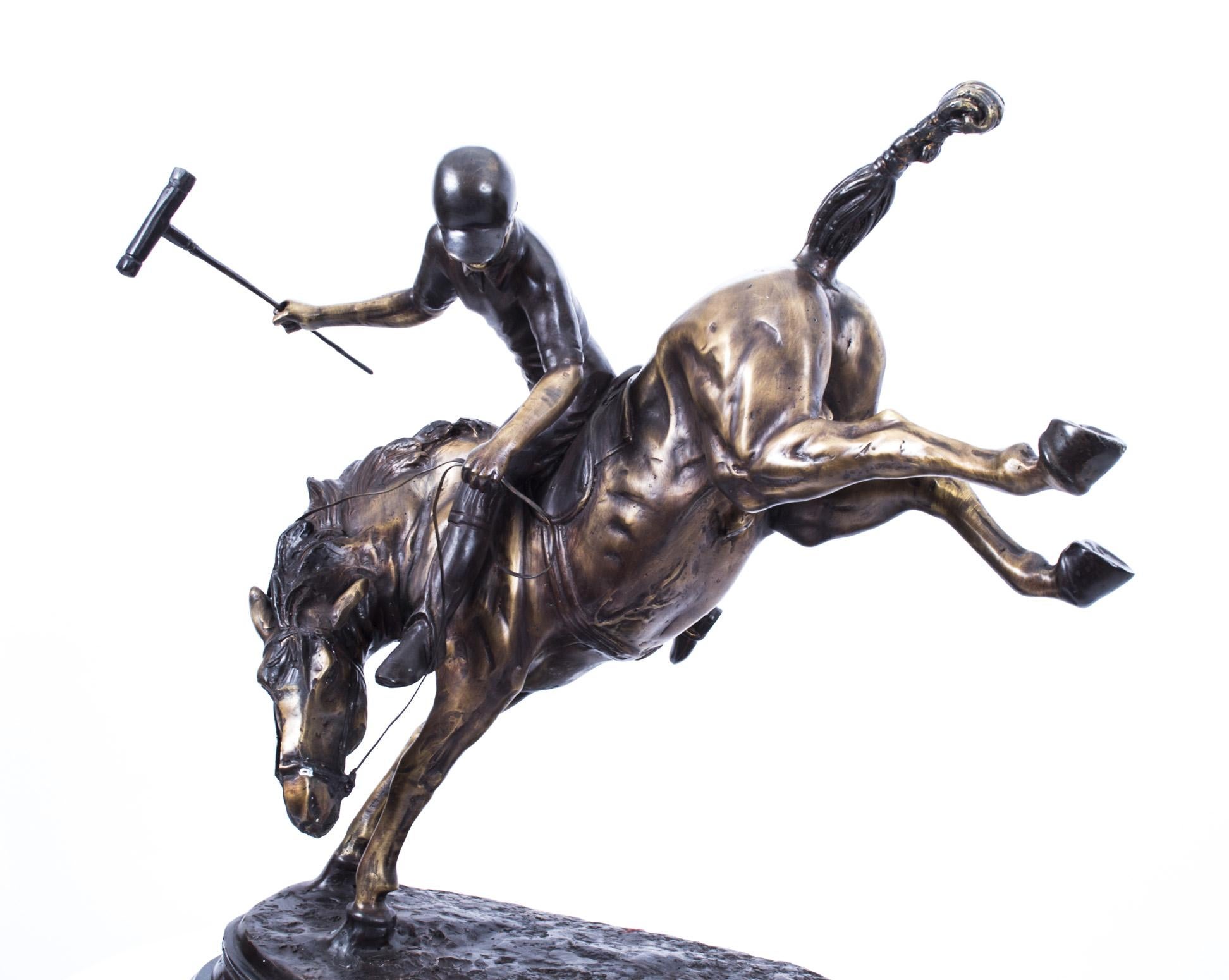A beautiful bronze sculpture of a polo player in mid-swing on a bucking horse, dating from the last quarter of the 20th century.

The artist amazingly captures this action scene with the horse's hind legs fully kicked in the air.

The attention