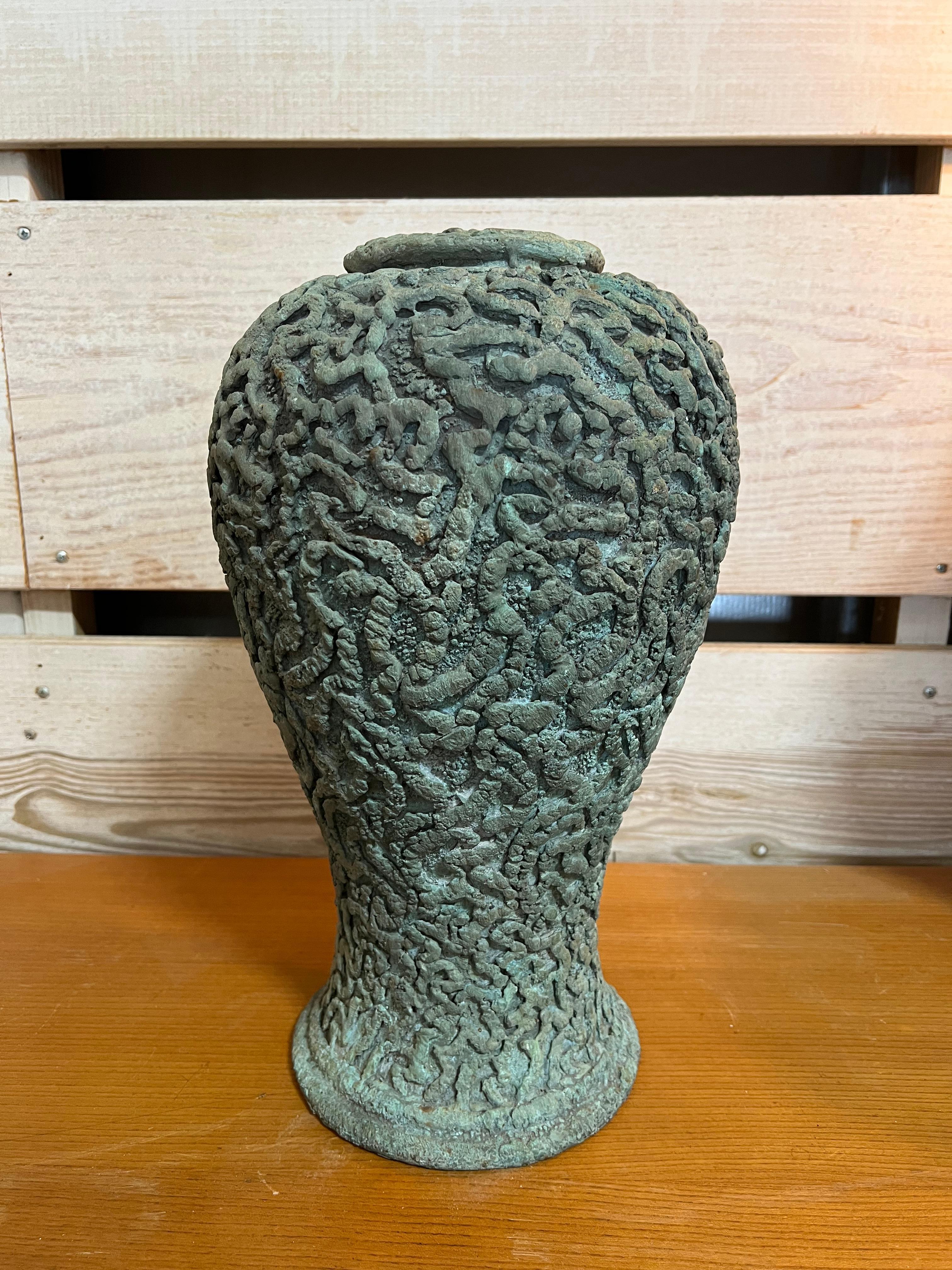 Midcentury handmade sculptural bronze vase by Charles Fach. It is signed. 