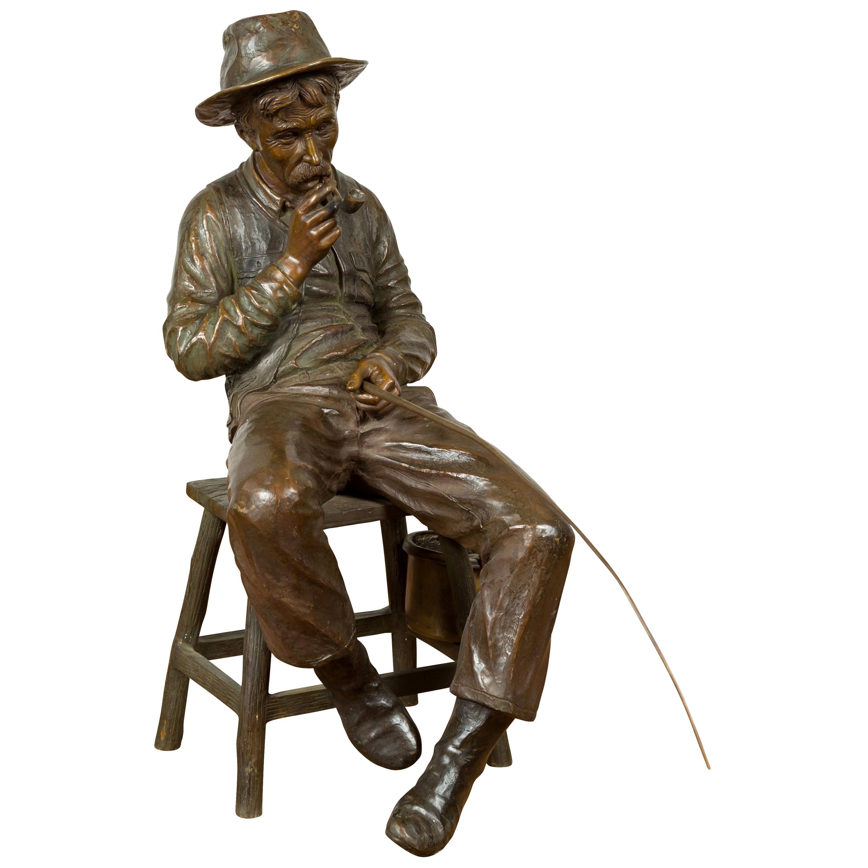 Vintage Bronze Sculpture of a Sitting Old Timer Smoking His Pipe and Fishing