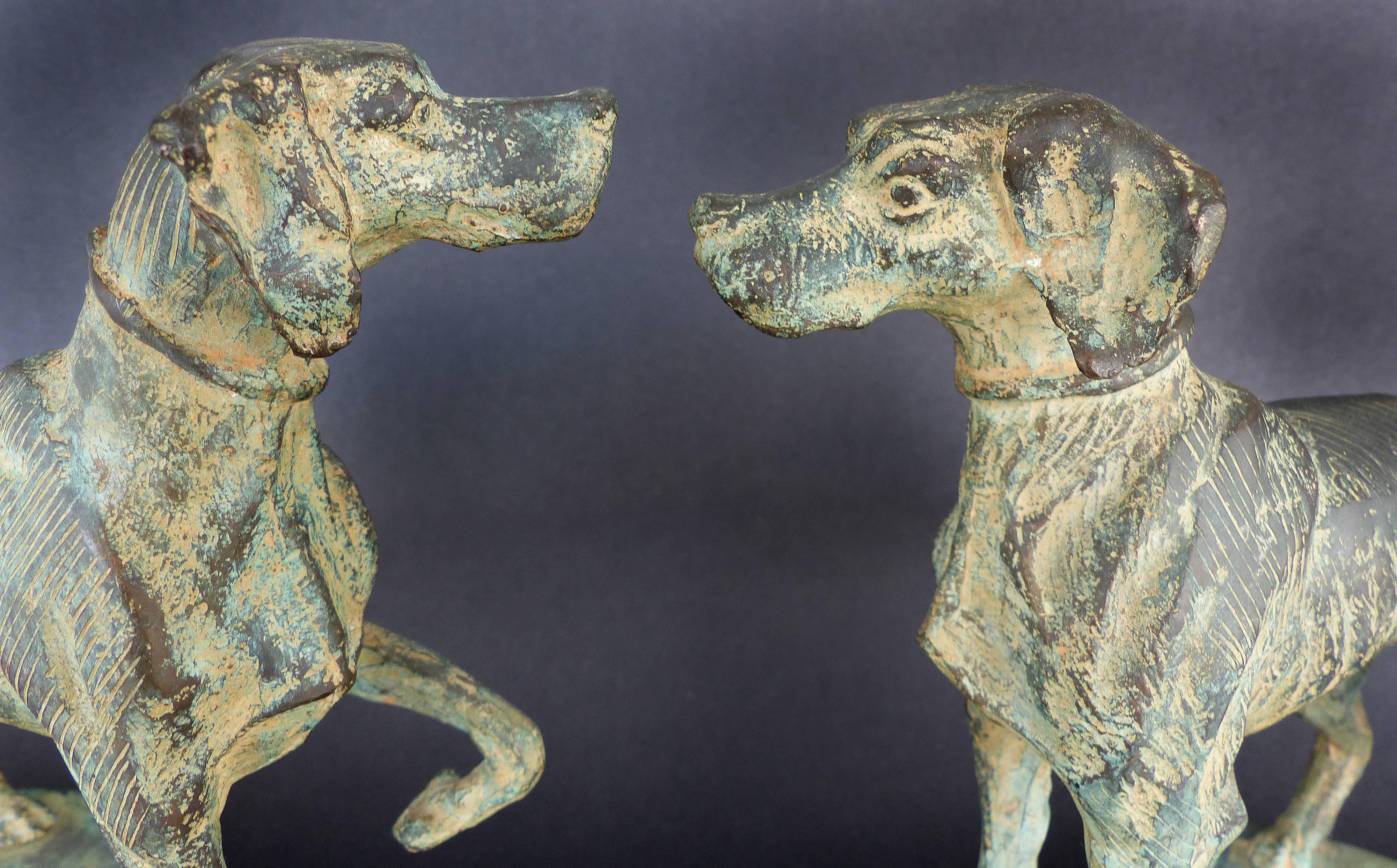 Vintage Bronze Sculpture of Two Hunting Dogs

Offered for sale is a vintage bronze sculpture of two hunting dogs presented on a curved base. The work is finished in an aged verdigris patina. The sculpture is viewed equally from either side. A great