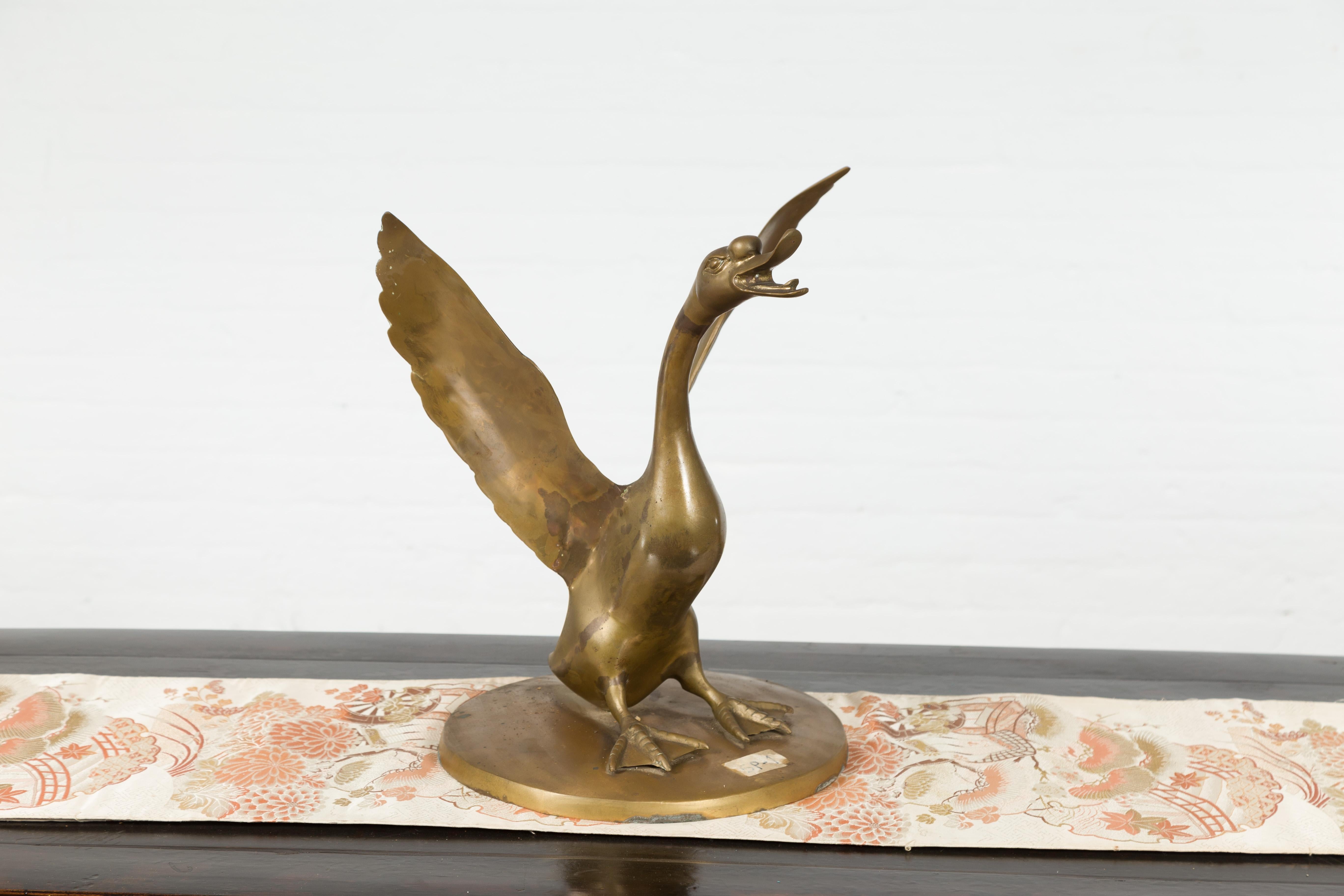 Cast Vintage Bronze Statue of a Swan Extending its Wings with Golden Patina For Sale