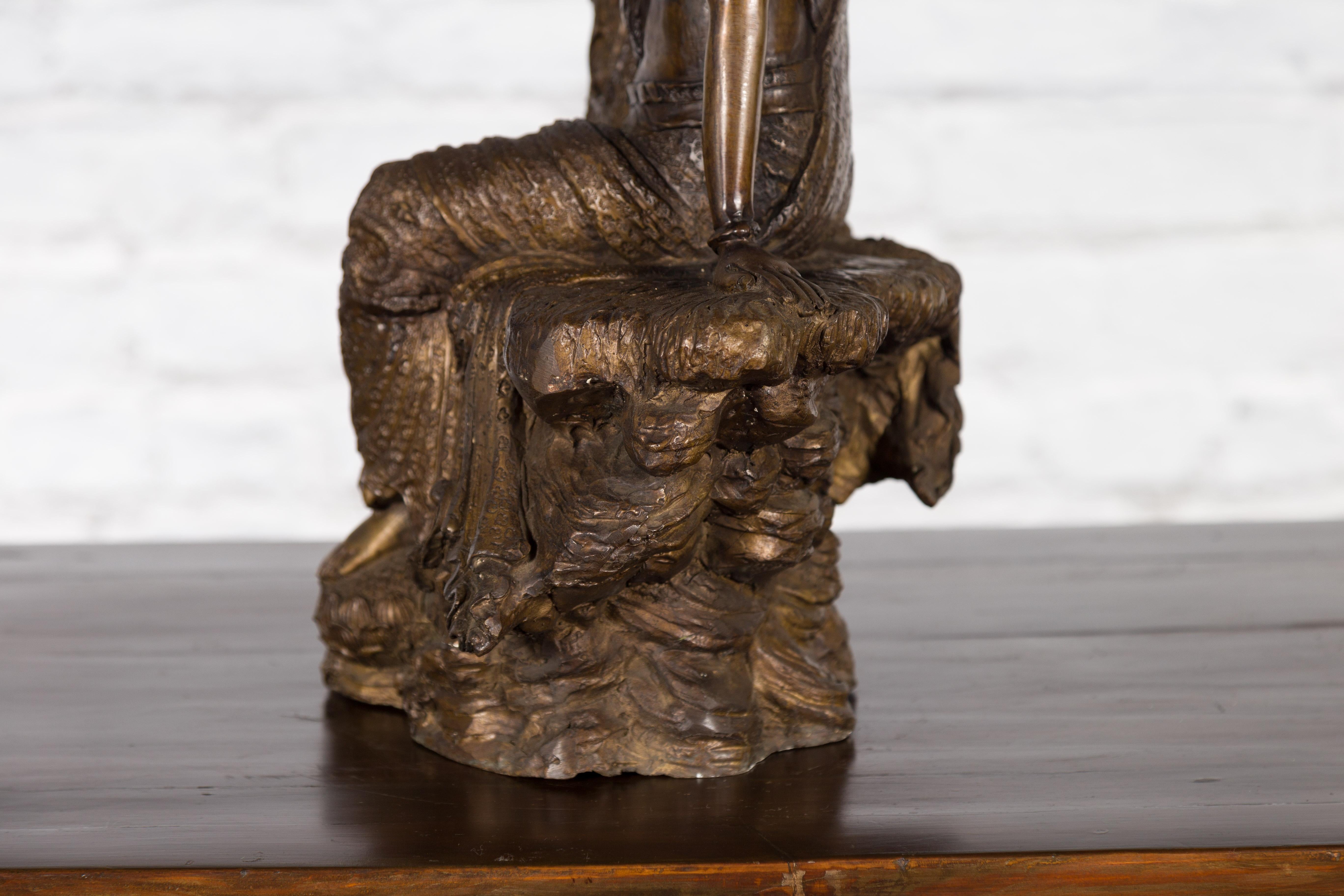 Vintage Bronze Statuette Depicting Quan Yin Seated on a Rocky Formation For Sale 12