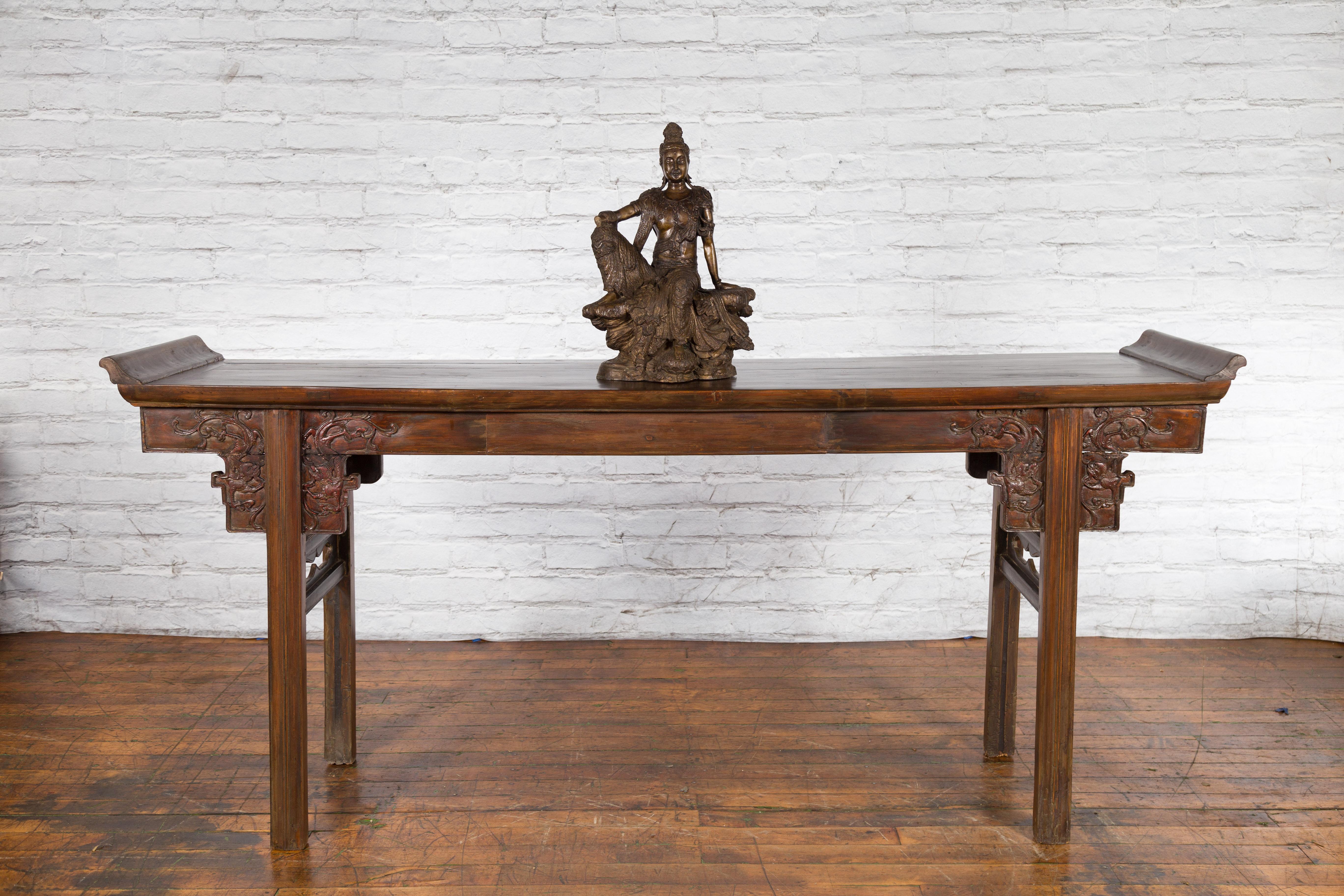 Asian Vintage Bronze Statuette Depicting Quan Yin Seated on a Rocky Formation For Sale