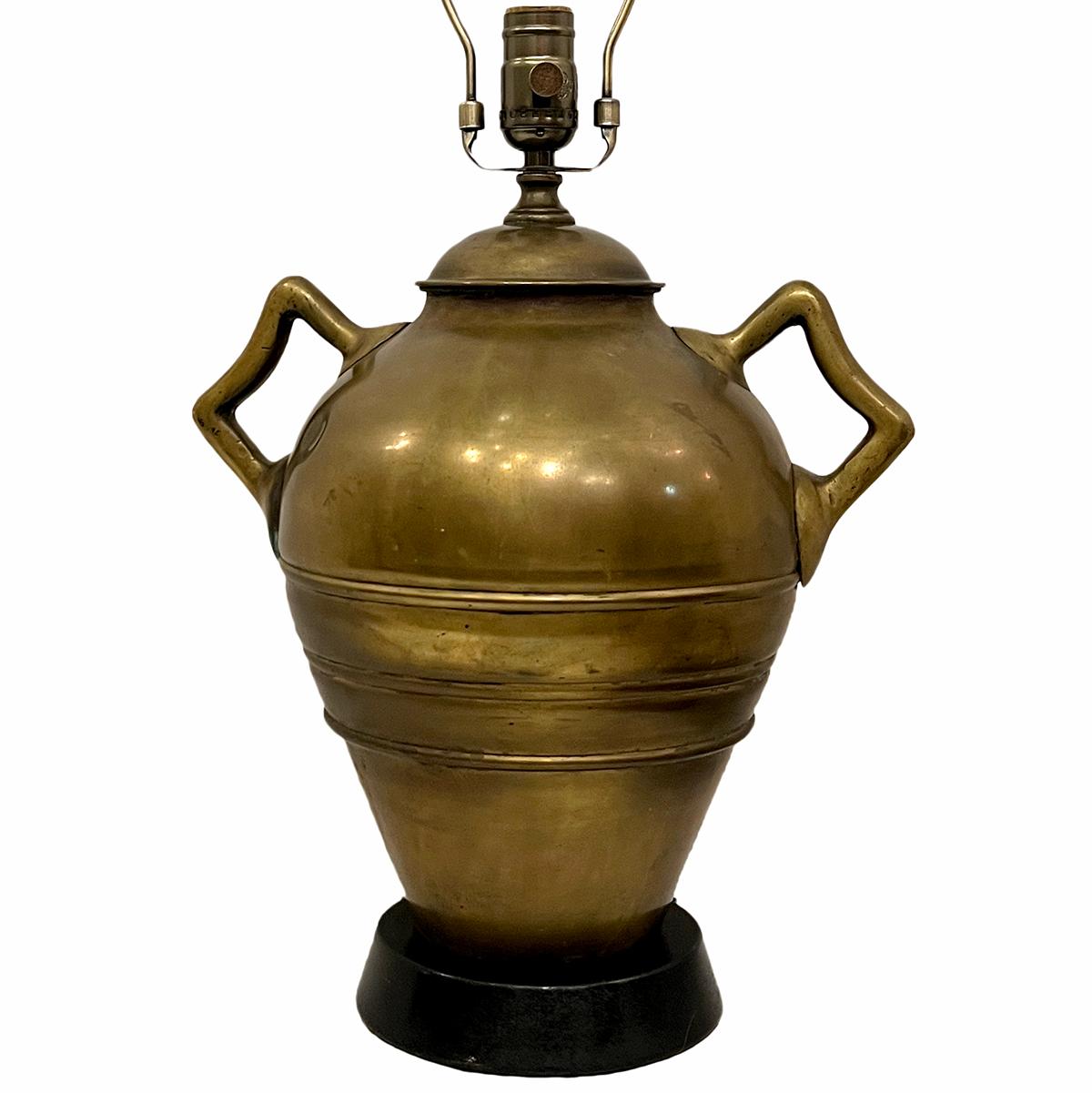 A circa 1920's English bronze lamp with wooden base.

Measurements:
Height of body:  14