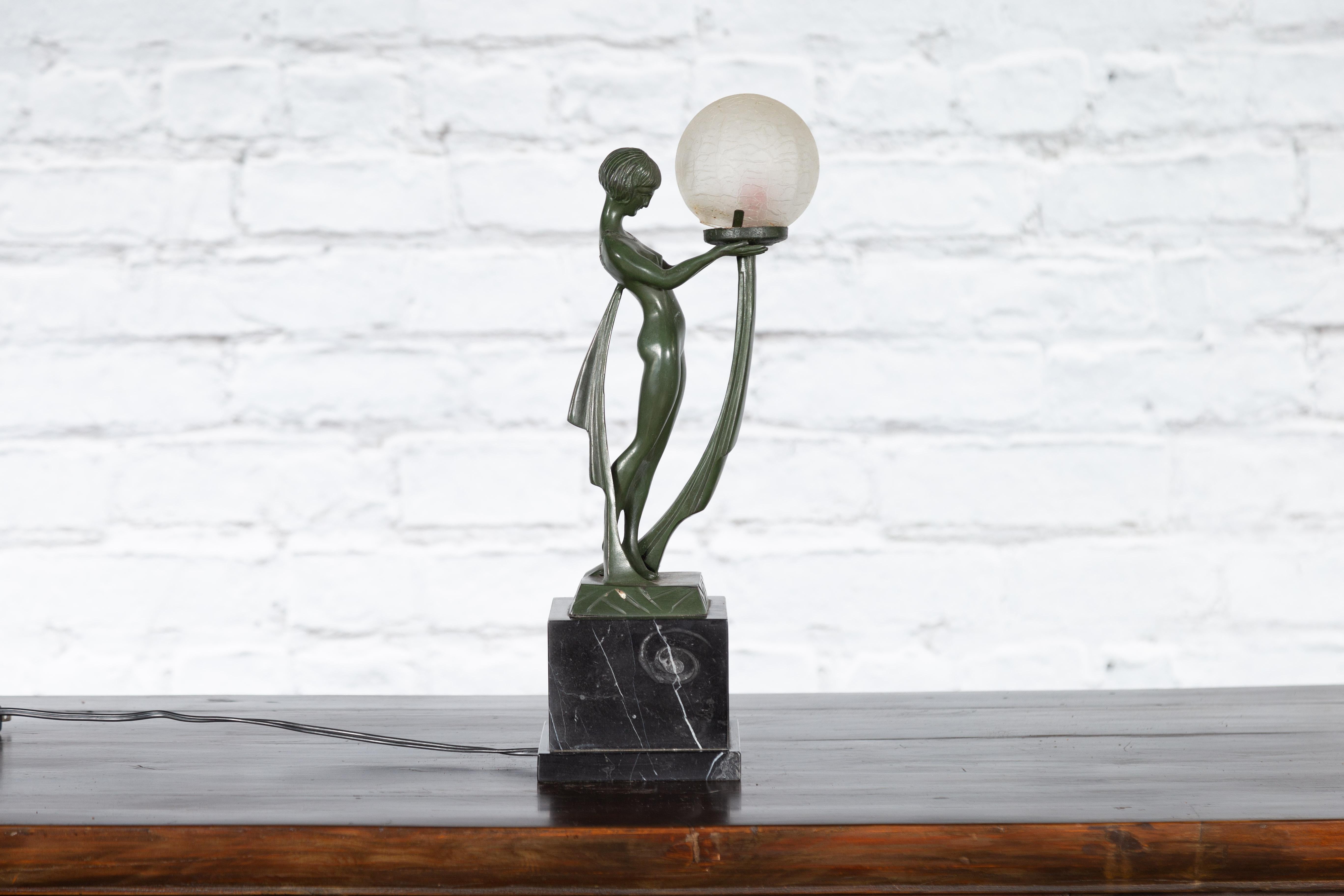 Mid-Century Modern Vintage Bronze Table Lamp of a Maiden Holding a Large Glass Sphere on Base For Sale