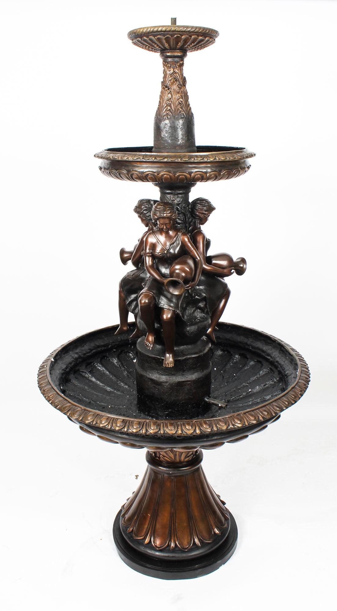 This is a beautiful vintage three-tier free standing or pond garden fountain sculpted in bronze in the Victorian style, dating from the late 20th century.
 
The fountain is heavily decorated with acanthus leaves, anthemion and fluting in high