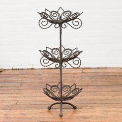 Vintage Bronze Three-Tier Stand with Scrolled Motifs and Tripod Base