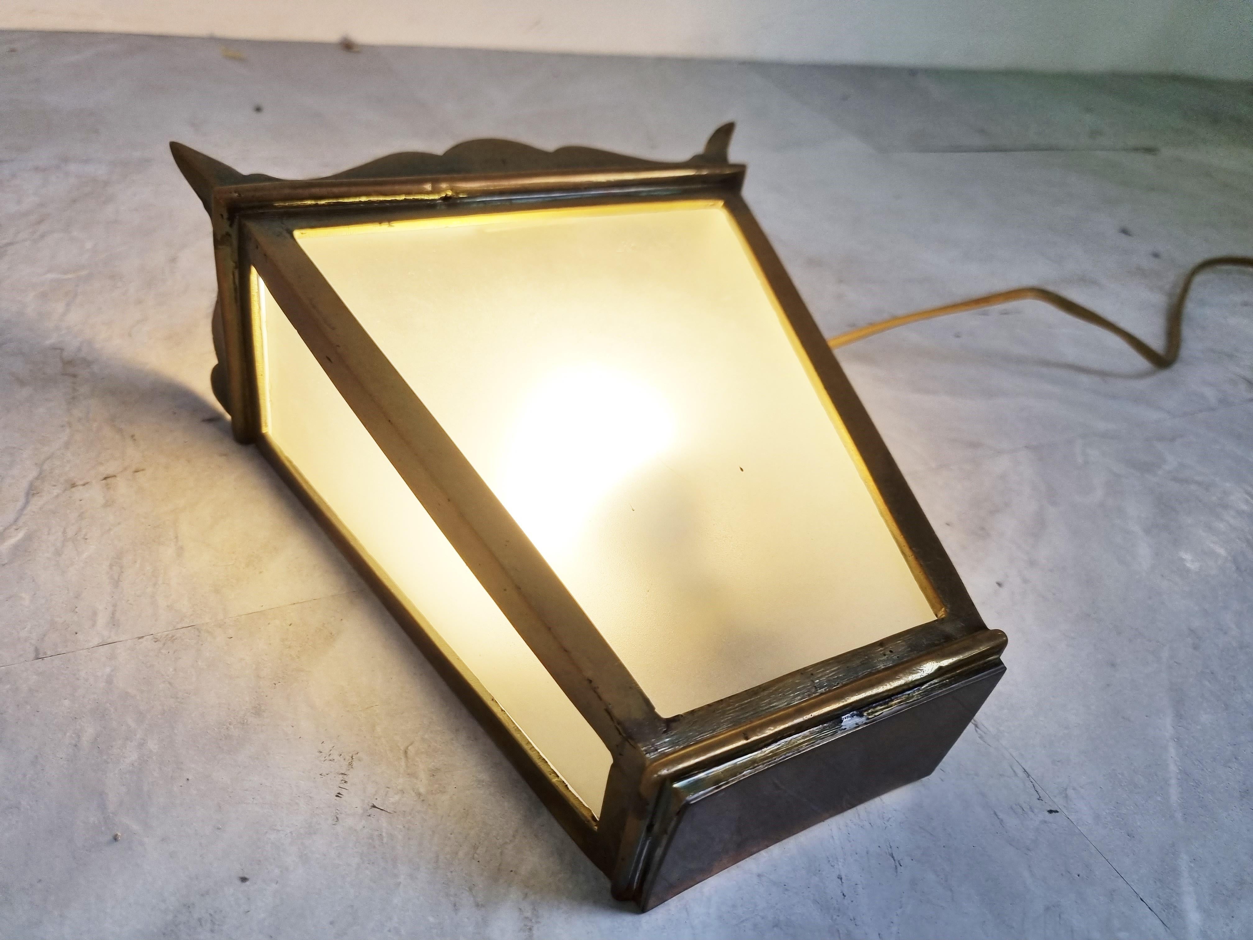 Elegant mid-century bronze wall lamps with frosted glass.

The lamps emit a soft light.

Tested and ready for use with a regular e14 lamp.

1960s - France

Dimension:
Height: 22 cm / 8.66