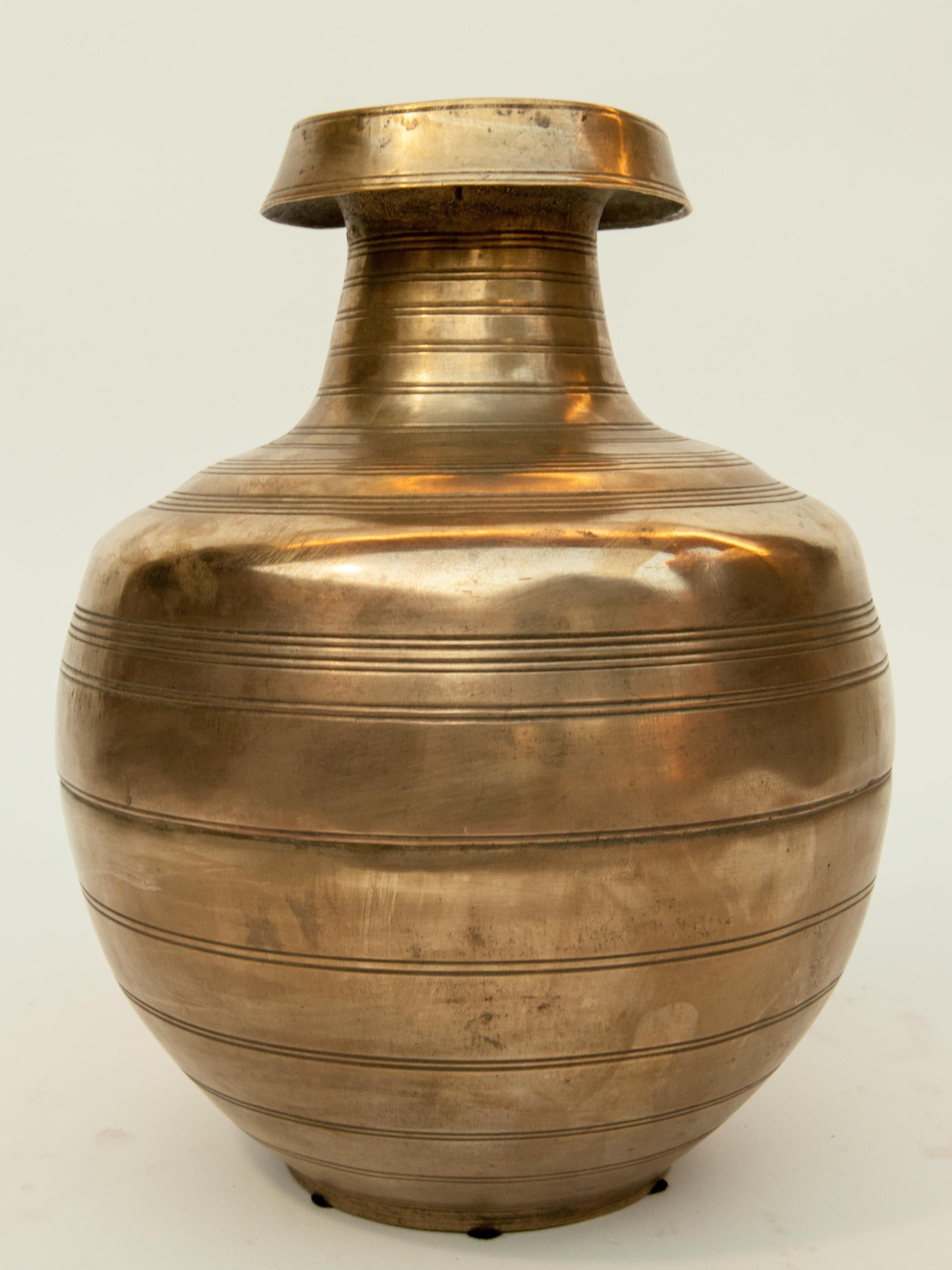 Vintage bronze water pot from Nepal, mid-20th century.
Offered by Bruce Hughes.
A beautifully balanced bronze pot from the Terai region of Nepal. With a natural aged patina, this pot was used in a Muslim household to collect and store water. In