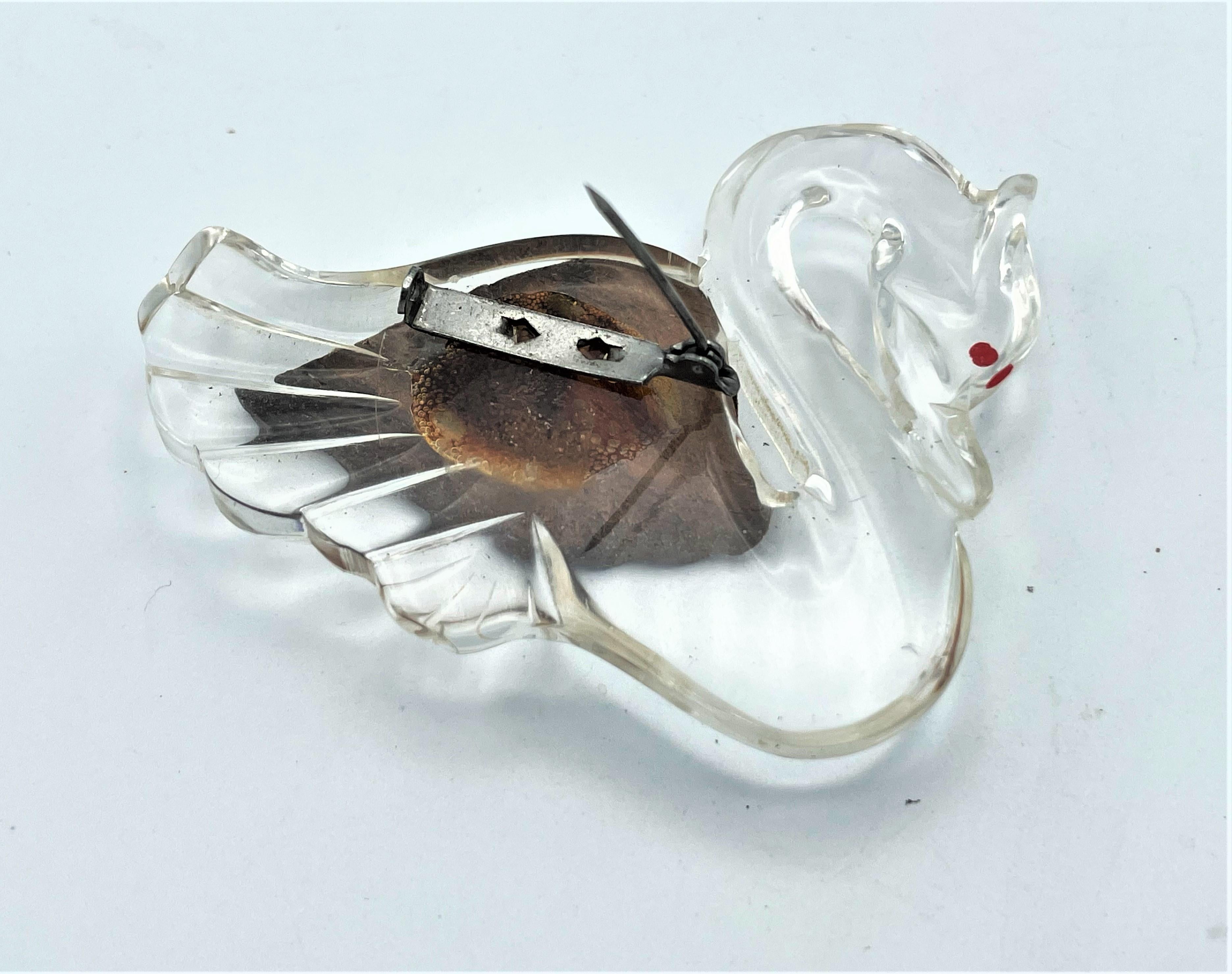 Women's or Men's Vintage brooch in the shape of a swan made of clear Lucite and wooden wings 1940 For Sale