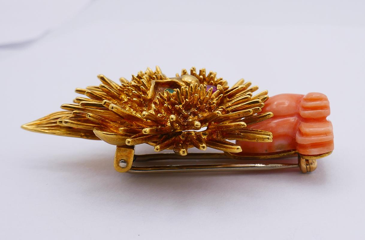 An adorable vintage pin made of 18 karat gold, coral and gemstones.
The brooch designed as a cute little lion and can be worn as a Leo Zodiac sign piece of jewelry. The clip is a great gift for everyone born between July 23 and August 22. 
The
