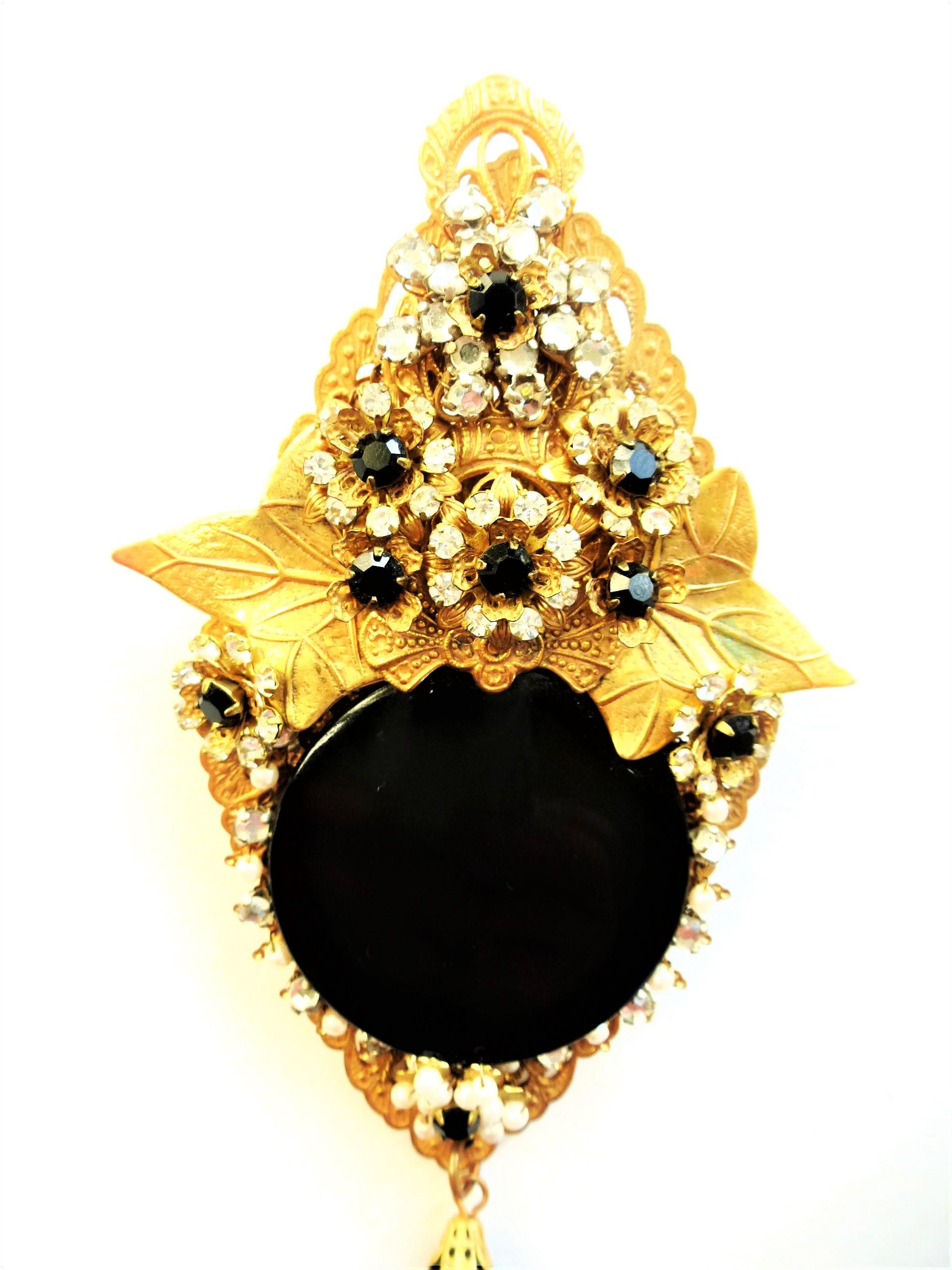 Vintage Stanley Hagler Brooch of the most dramatic kind. 
Opulent and complex, Stanley Hagler's  jewelry combines contemporary design with antique components. He always used the finest materials, such as hand-blown glass, Swarovski crystals, and