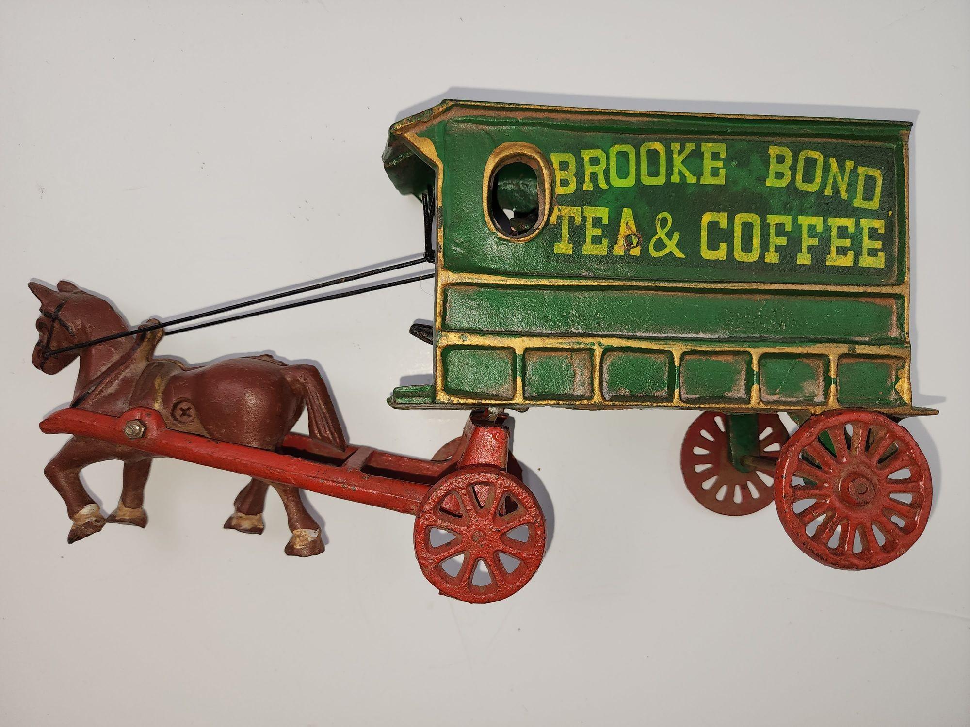 Vintage Brooke Bond Tea and Coffee Cast Iron Horse and Wagon, Driver included.
Please look at all the pictures antique Cast iron coach, horse and wagon in good vintage condition, wheels roll.
Antique Cast Iron Green Toy Brooke Bond Tea & Coffee