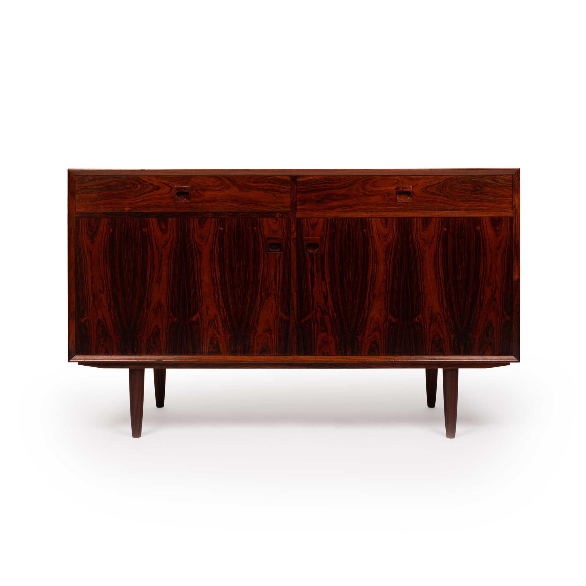 Brouer Møbelfabrik was a Danish furniture manufacturer renowned for its high-quality craftsmanship and timeless mid-century modern designs. The company specialized in producing furniture made from fine woods, such as teak and rosewood, focusing on