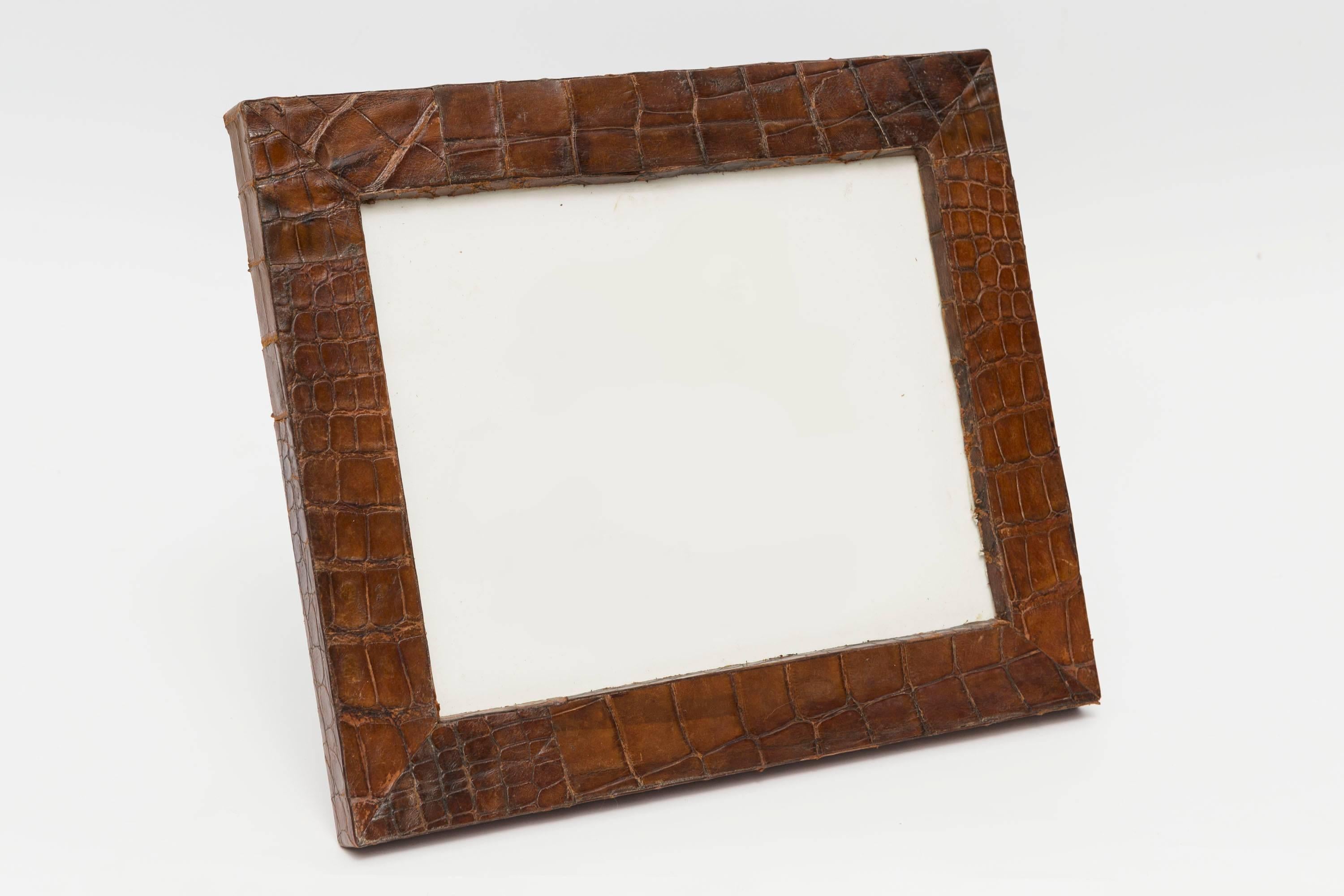 This is a vintage brown alligator picture frame of a nice size.