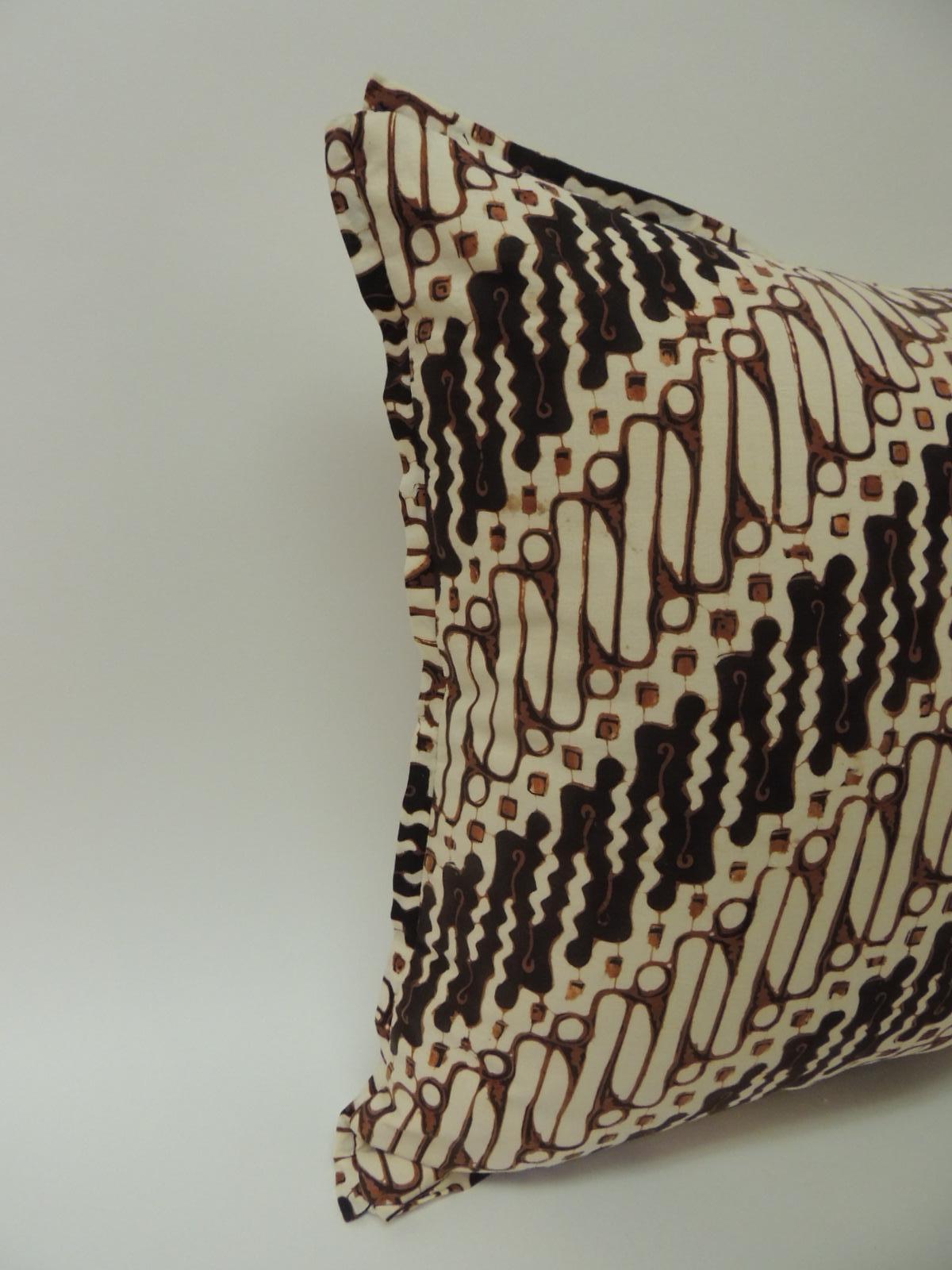 Vintage Beige, brown and black Batik decorative bolsters pillows handcrafted with 1970s vintage lumbar hand-blocked Batik artisanal textile panel with the traditional tribal design in shades of brown, black, natural and with a mocha color detail.