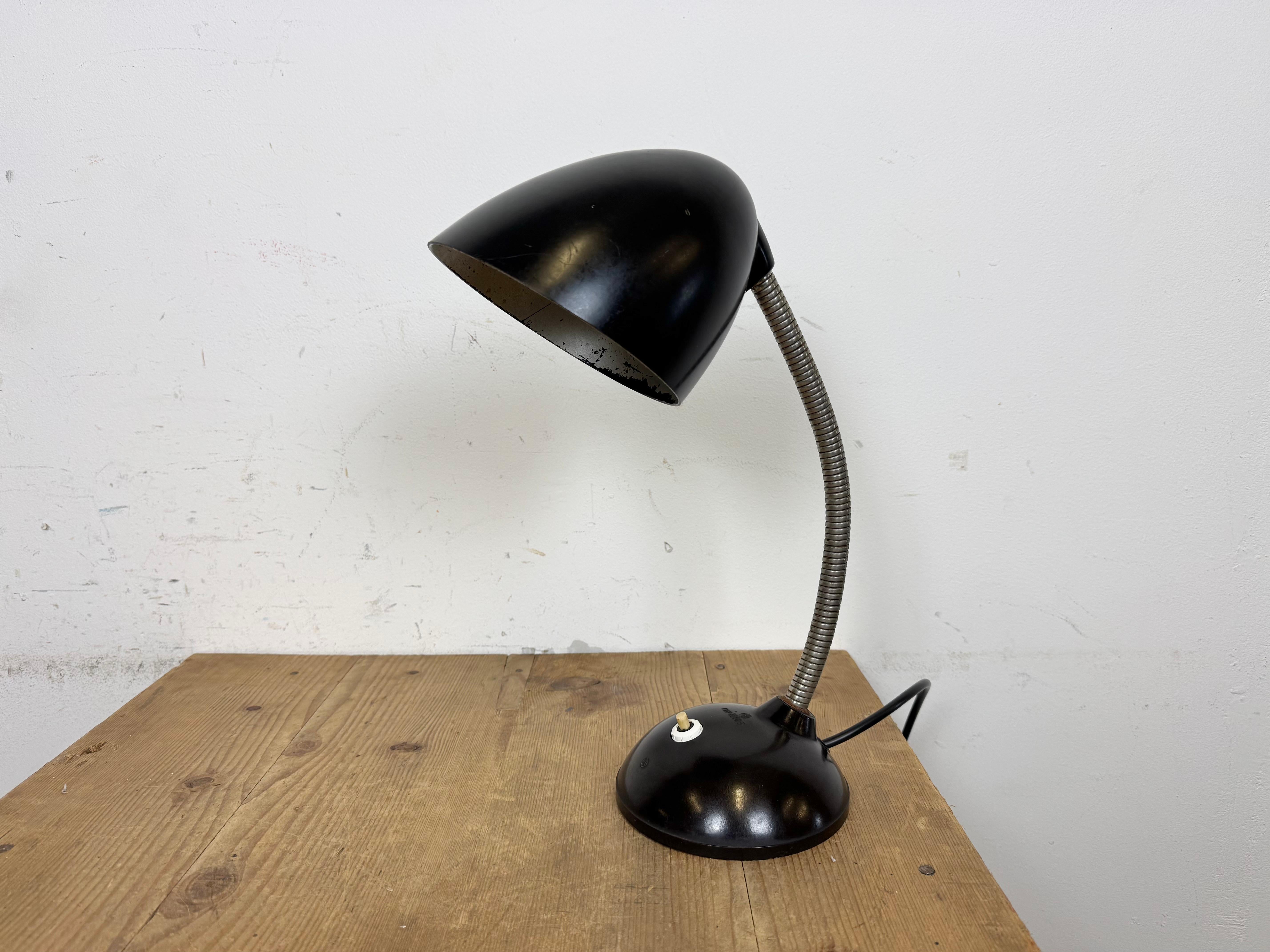 Brown industrial adjustable gooseneck table lamp made by Elektrosvit in former Czechoslovakia during the 1960s. It features a bakelite shade and base and iron gooseneck.The original socket requires standard E27 / E26 lightbulbs. . New wire. Good