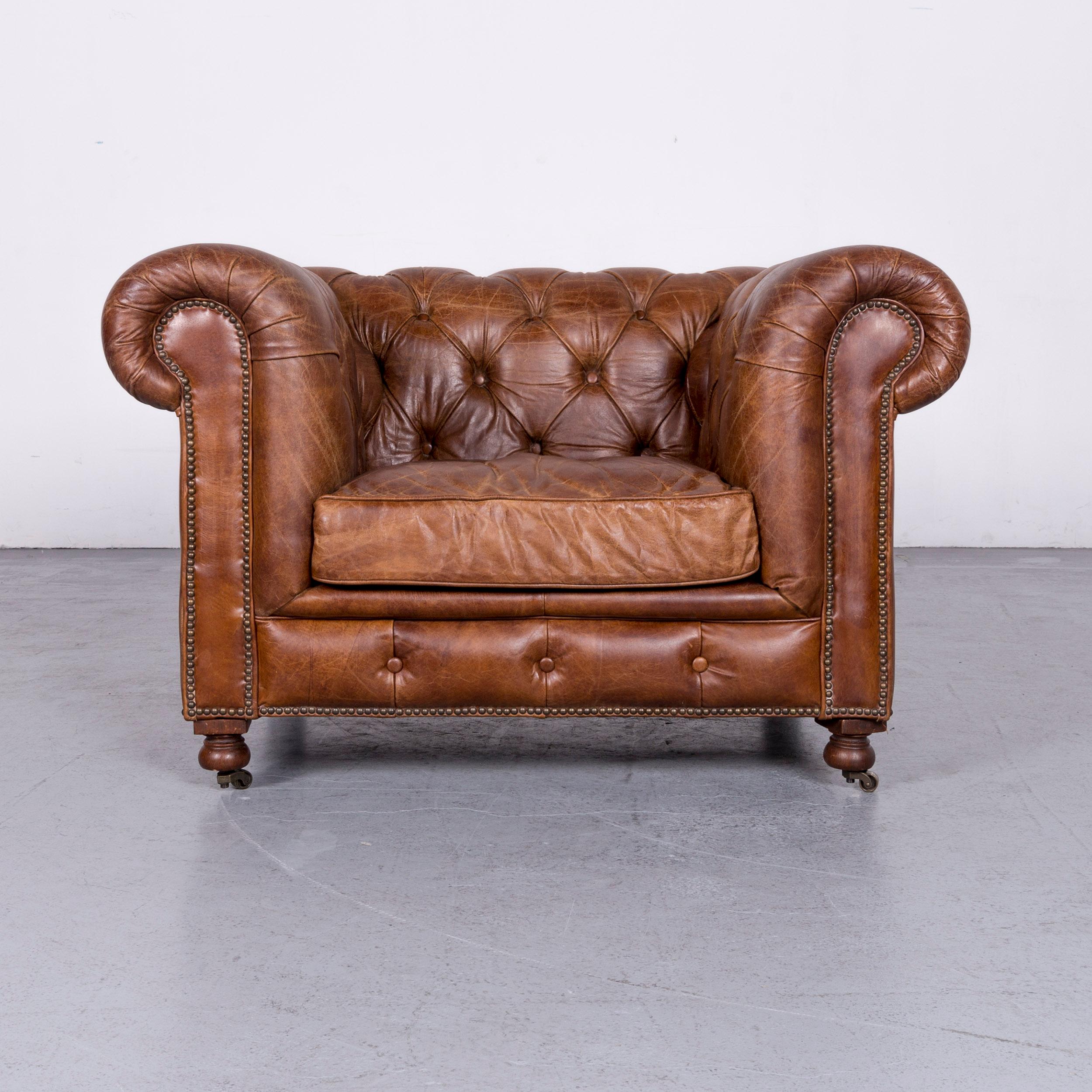 We bring to you a vintage brown Chesterfield leather armchair buttoned club chair in brown.