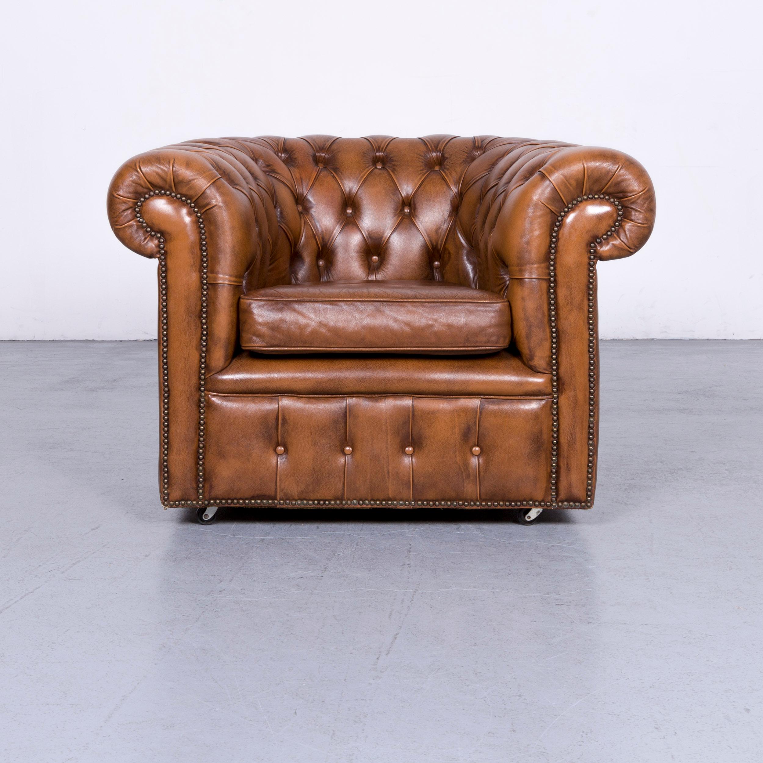 We bring to you a vintage brown Chesterfield leather armchair buttoned clubchair.