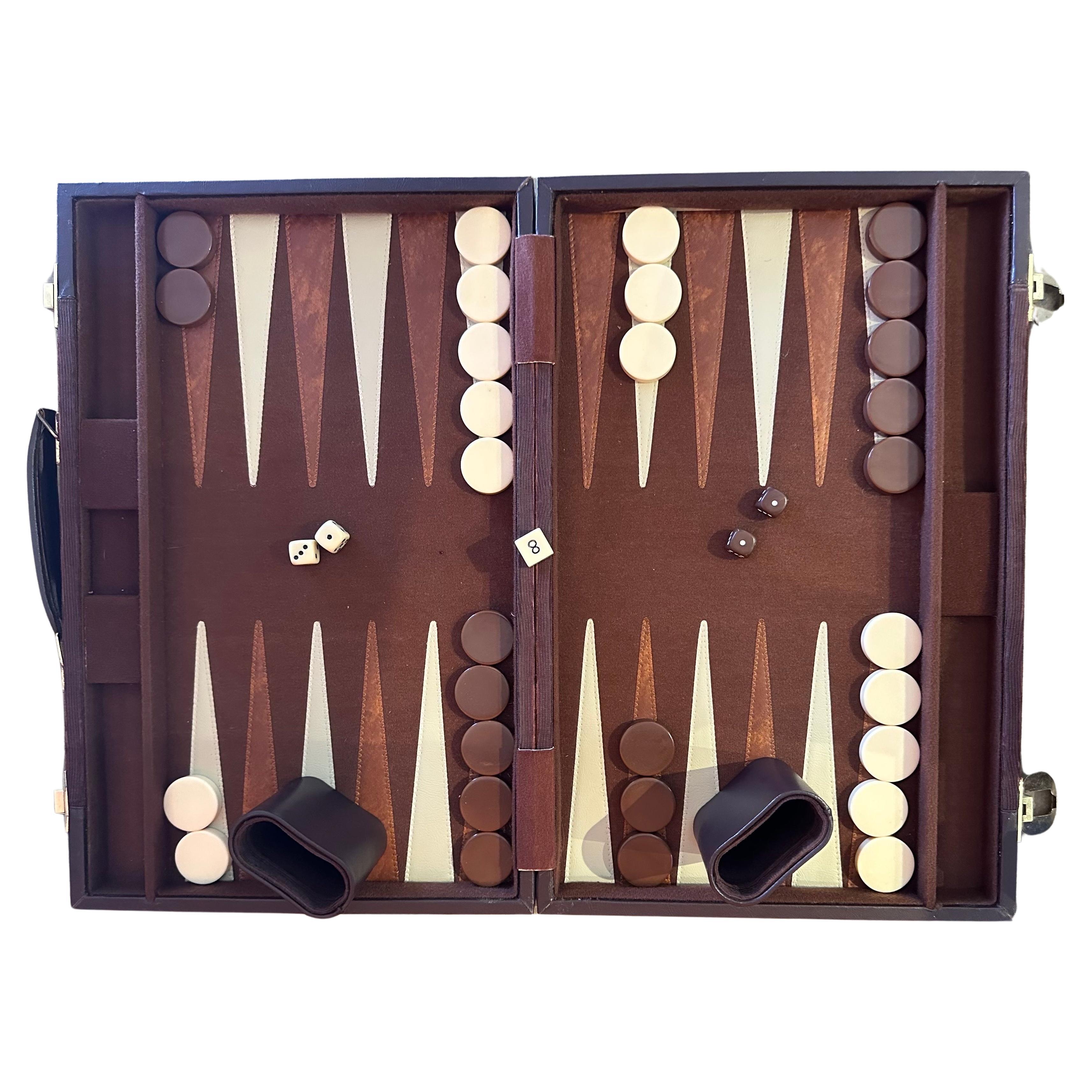 Vintage corduroy and bakelite backgammon set, circa 1970s. Set is complete with a foldable case / board with brown corduroy fabric, 30 bakelite checkers (cream and brown in color, 1.25