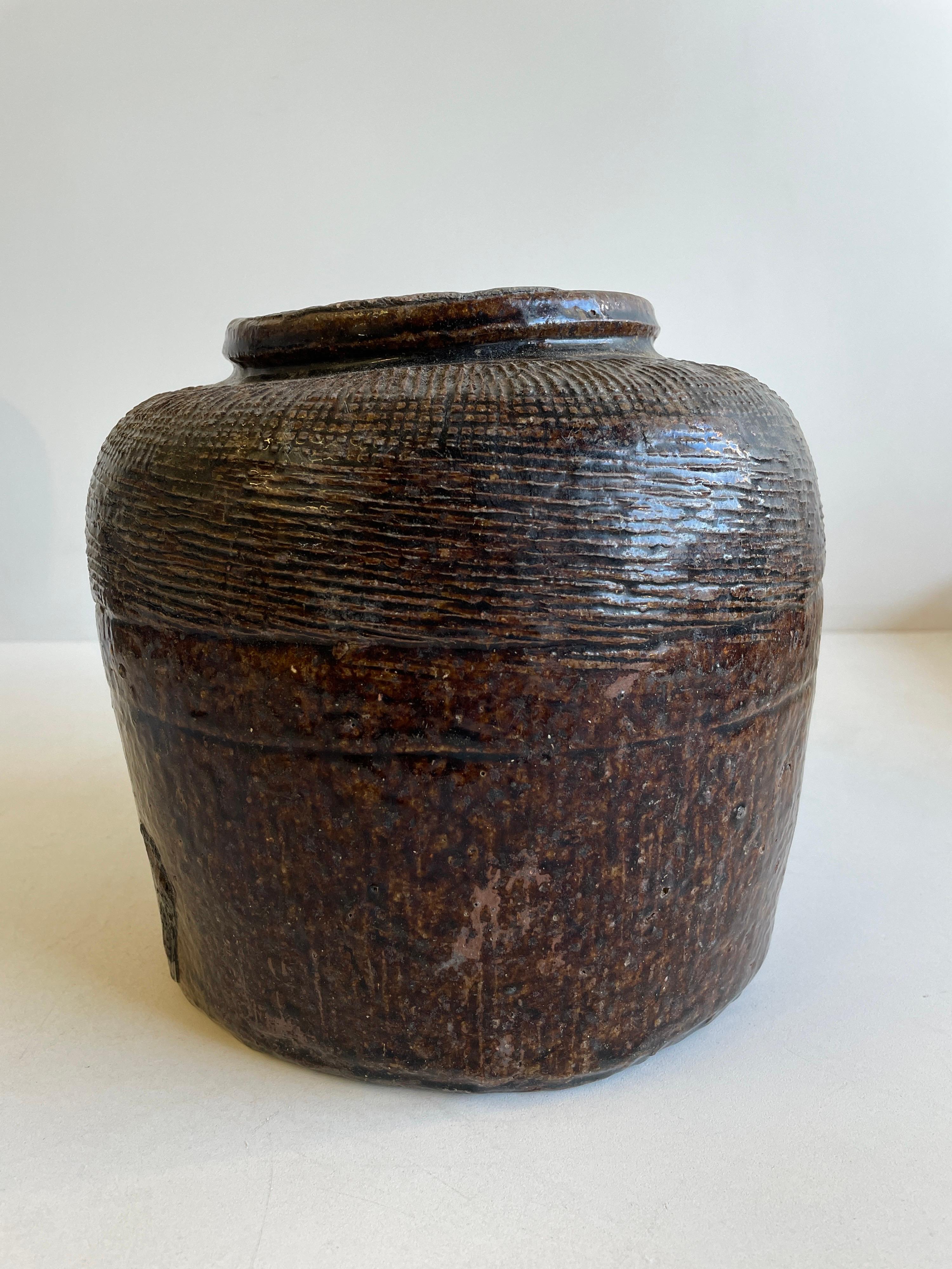 Beautifully glazed and rich in character, this vintage glazed oil pot adds just the right amount of texture + warmth where you need it. Stunning glazed finish with warm terra-cotta accents. Coloring is an olive green, dark brown tones. Each piece is