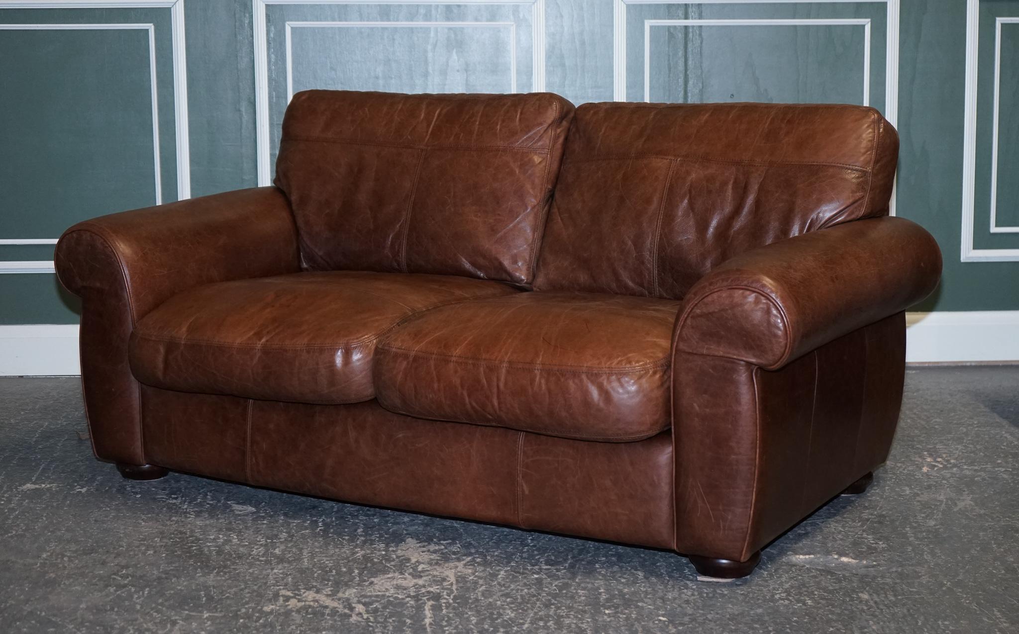 We are delighted to offer for sale this gorgeous brown leather saddle leather two seater sofa.

Excellent quality and solid frame built inside the sofa; cushions are still plump and have plenty of good use left. 

We have lightly restored this