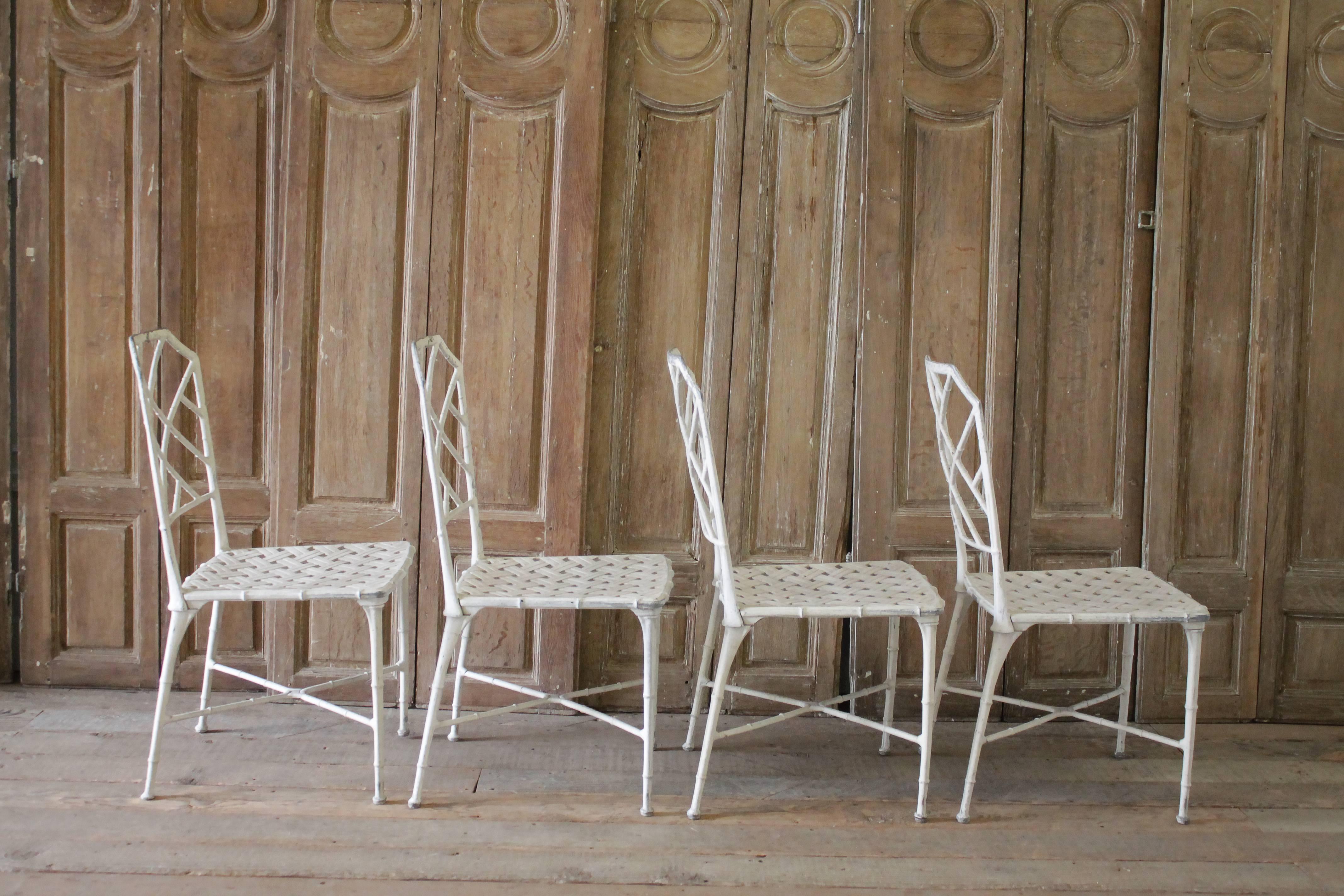 Vintage faux bamboo brown Jordan Calcutta metal Chippendale style chairs lattice cross chinoiserie Hollywood regency indoor outdoor patio furniture white with no cushions.

Four-piece set. Cast in solid aluminium this set is stout and heavy not