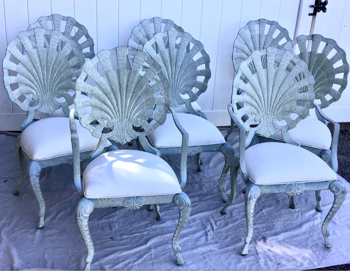 A set of 8 amazing vintage shell back grotto style patio chairs by Brown Jorden. The chairs have such amazing design with a large clam shell back and pretty curved legs. They are very sturdy and are in very good condition and have a heavy casting.